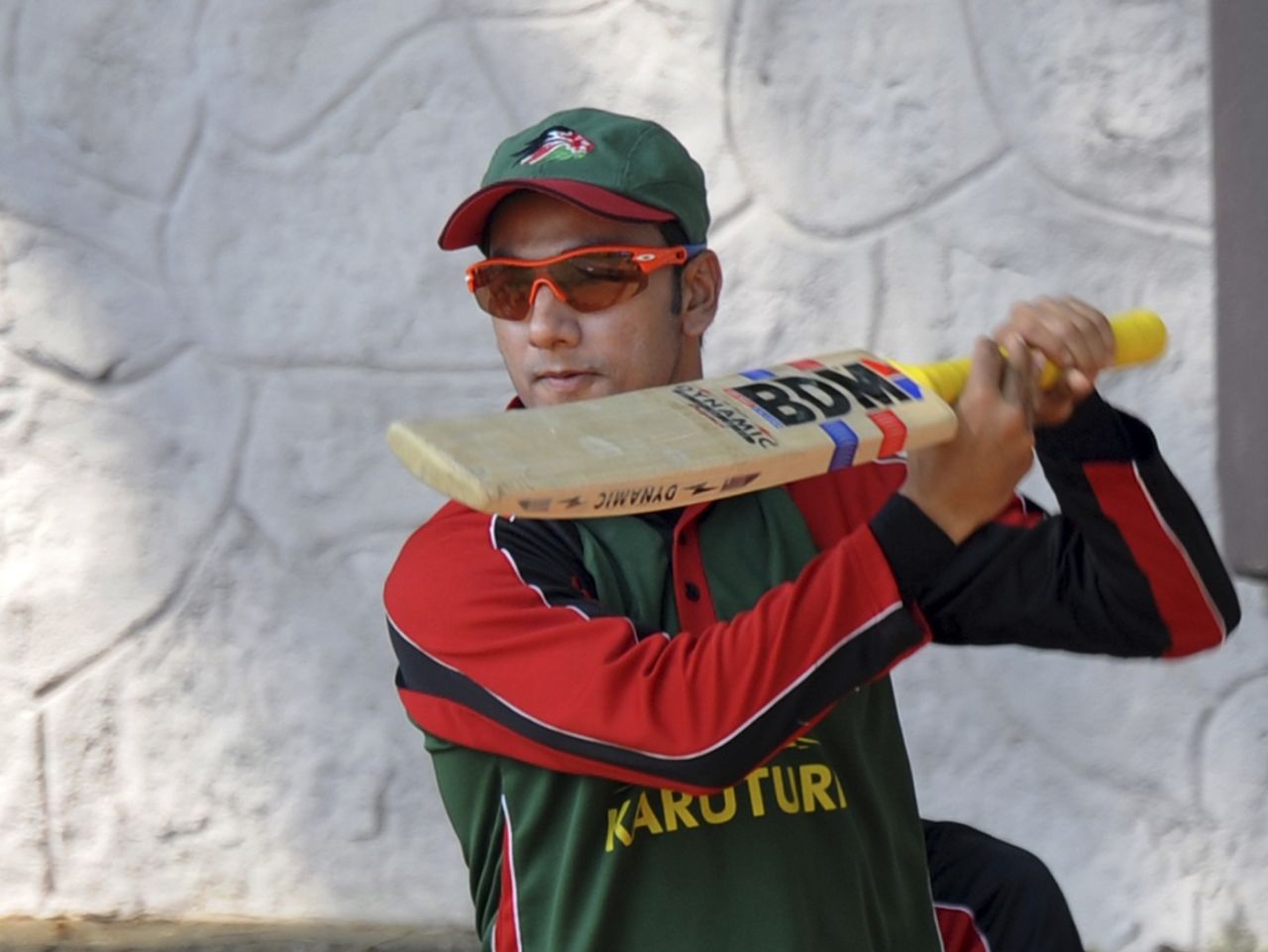 Tanmay Mishra has a close look at his bat, Bengaluru, March 10, 2011