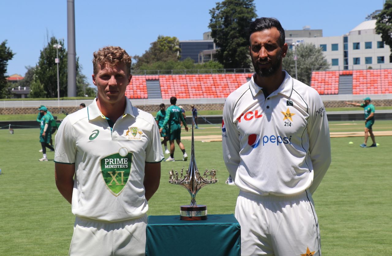 Prime Minister's XI captain Nathan McSweeney and Pakistan captain Shan Masood with the warm-up game trophy, Canberra, December 5, 2023