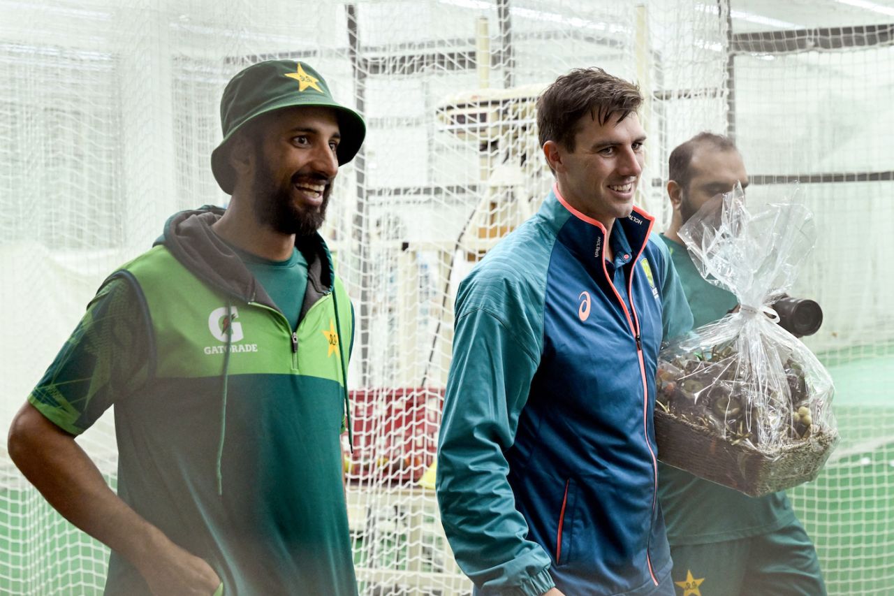 Pat Cummins is all smiles after receiving Christmas gifts from Shan Masood, Melbourne, December 25, 2023
