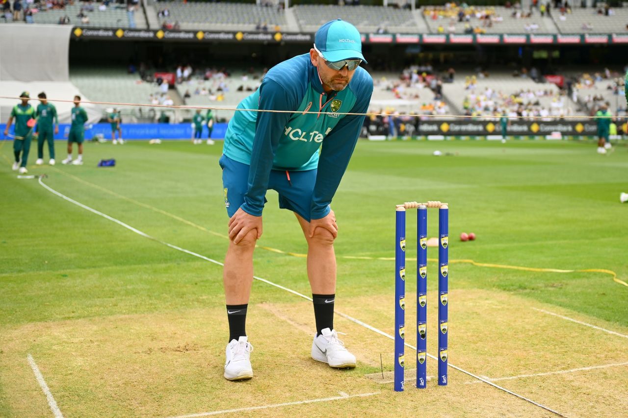 Nathan Lyon has a close look at the surface on Boxing Day, Australia vs Pakistan, 2nd Test, day one, Melbourne, December 26, 2023
