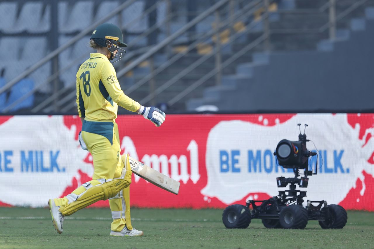 A roving robot camera captures Phoebe Litchfield as she walks back after a 98-ball 63, India vs Australia, 1st Women's ODI, Mumbai, December 30, 2023