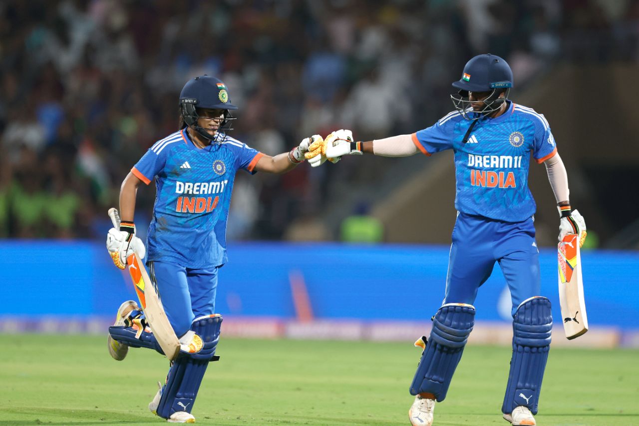 Amanjot Kaur gives Pooja Vastrakar a fist bump after the latter finished India's innings with a six over long-on, India vs Australia, 3rd Women's T20I, Mumbai, DY Patil Sports Academy, January 9, 2024
