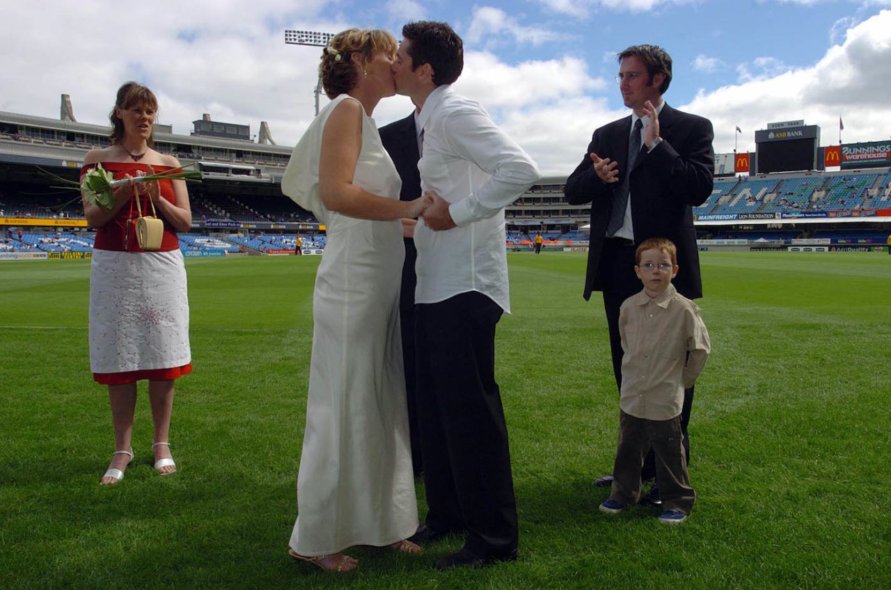 Lee Borcoski and Maria McElroy exchange vows and kiss as they get married on the boundary of Eden Park, 2nd day, 2nd Test, Auckland, March 19, 2004.