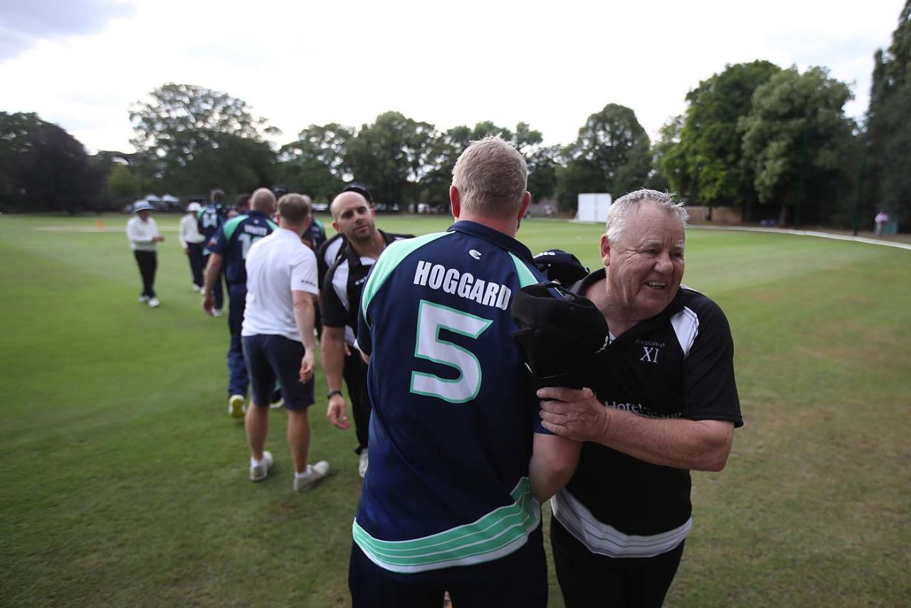 Mike Procter shakes hands with Matthew Hoggard during a PCA match at the Hurlingham Club in London, July 18, 2019