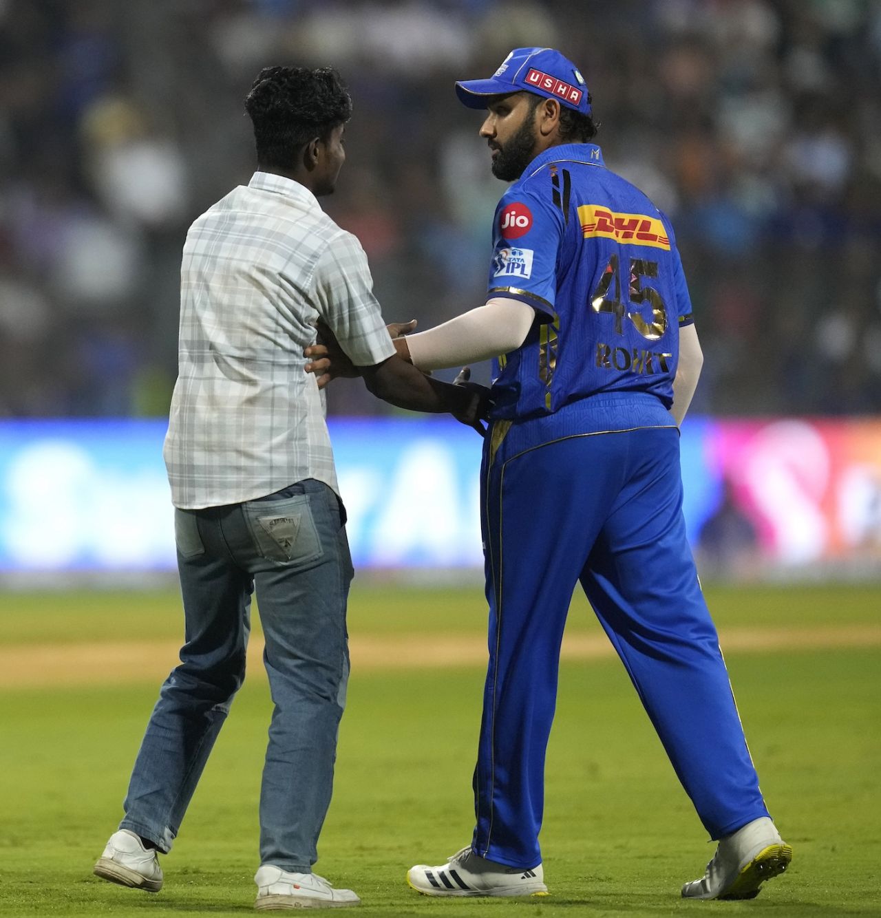 A fan finds his way out to the middle and get a feel of Rohit Sharma, Mumbai Indians vs Rajasthan Royals, IPL 2024, Mumbai, April 1, 2024