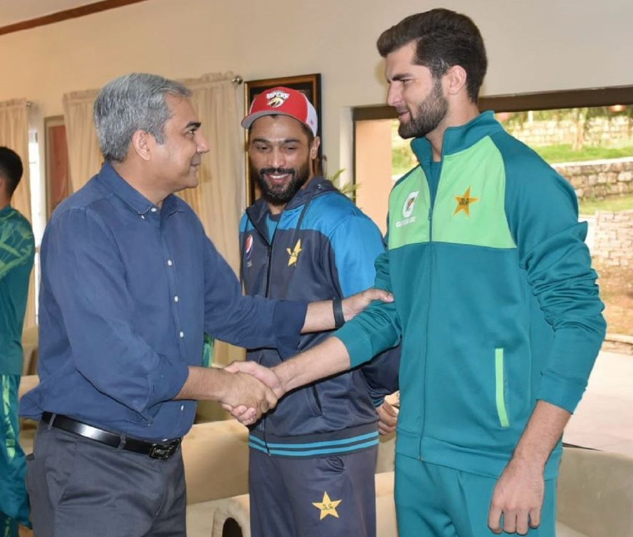 PCB chairman Mohsin Naqvi and Shaheen Shah Afridi shake hands as Mohammad Amir looks on, Kakul, April 1, 2024