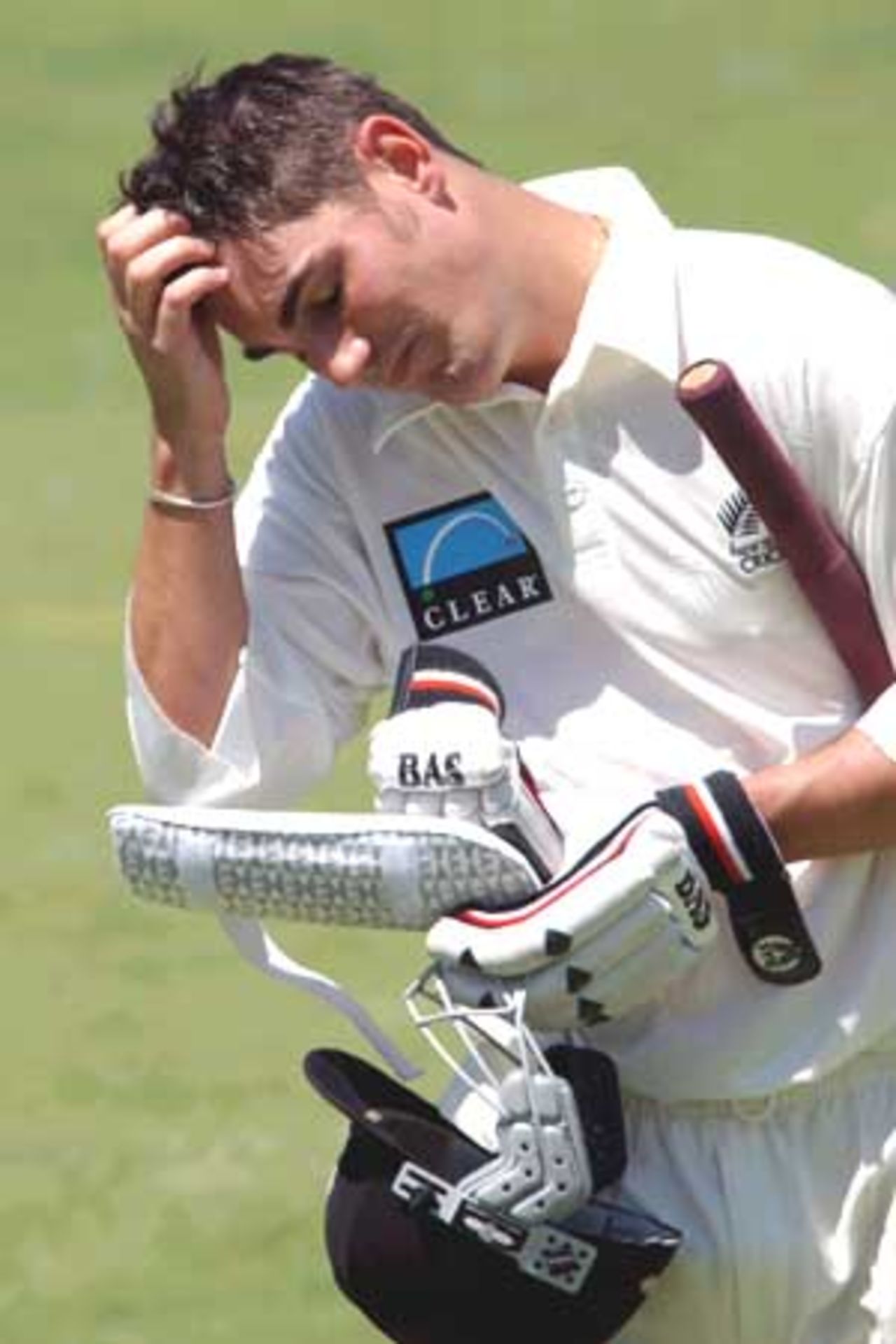 16 Oct 2001: Mathew Sinclair of New Zealand shows his disappointment after being bowled for 17 runs during the New Zealand Cricket team's tour match against the Queensland Academy of Sport XI which is being played at Allan Border Field in Brisbane, Australia.