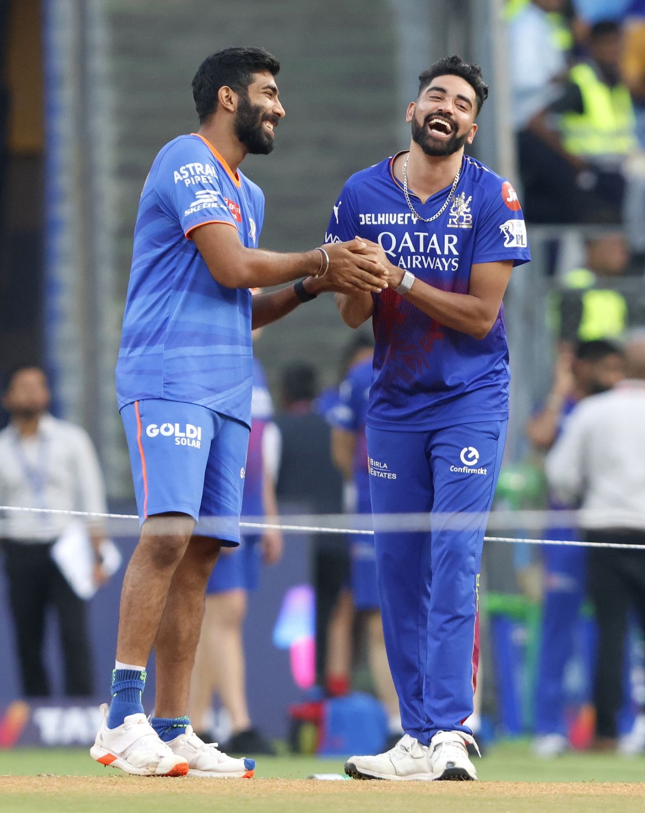 India mates and IPL rivals Jasprit Bumrah and Mohammed Siraj share a laugh, Mumbai Indians vs Royal Challengers Bangalore, IPL 2024, Mumbai, April 11, 2024