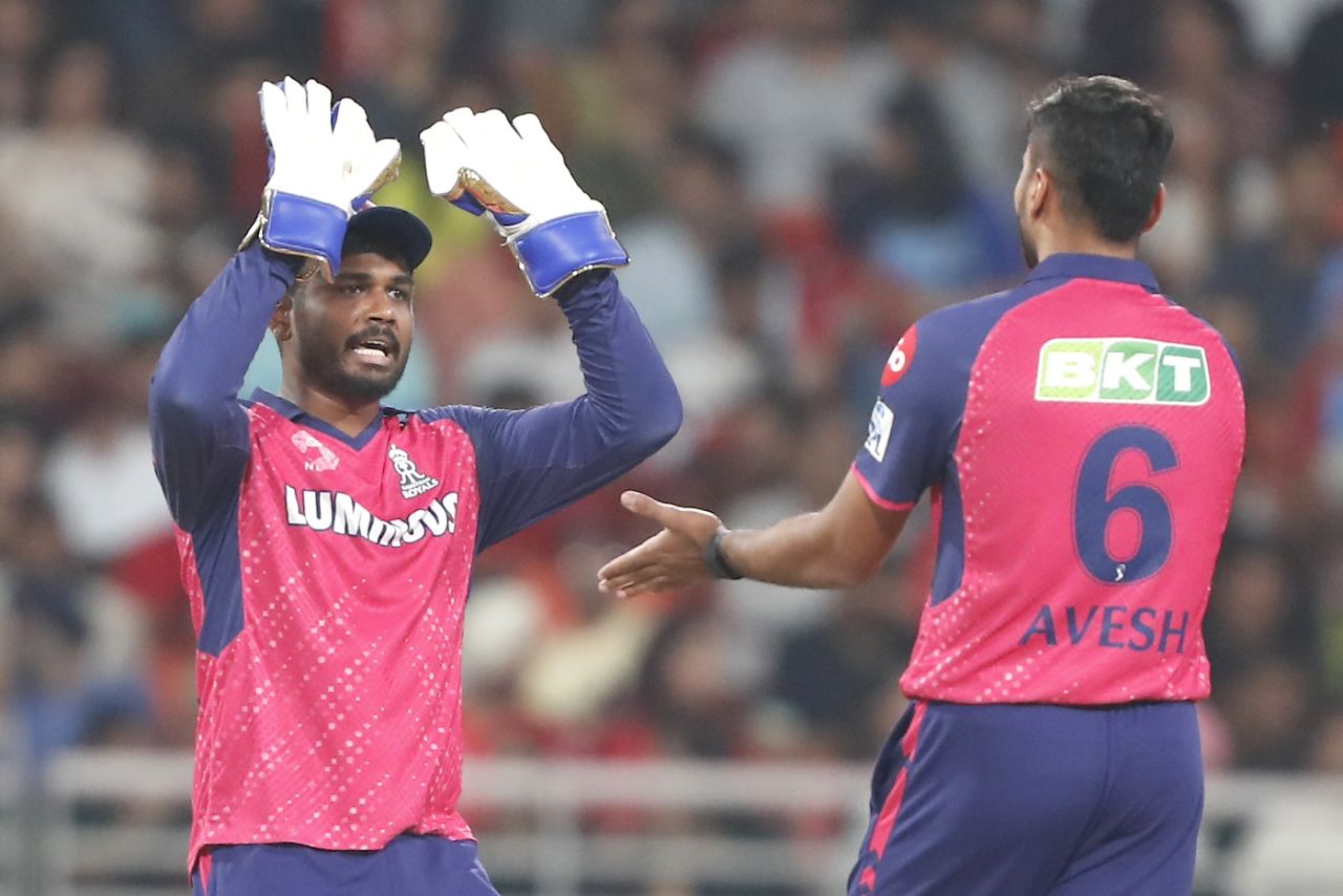 Sanju Samson and Avesh Khan celebrate after Atharva Taide's fall