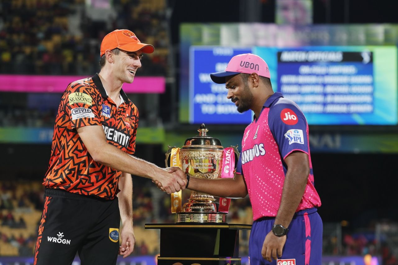 Pat Cummins and Sanju Samson shake hands, with eyes on the trophy behind them, Sunrisers Hyderabad vs Rajasthan Royals, Qualifier 2, IPL 2024, Chennai, May 24, 2024