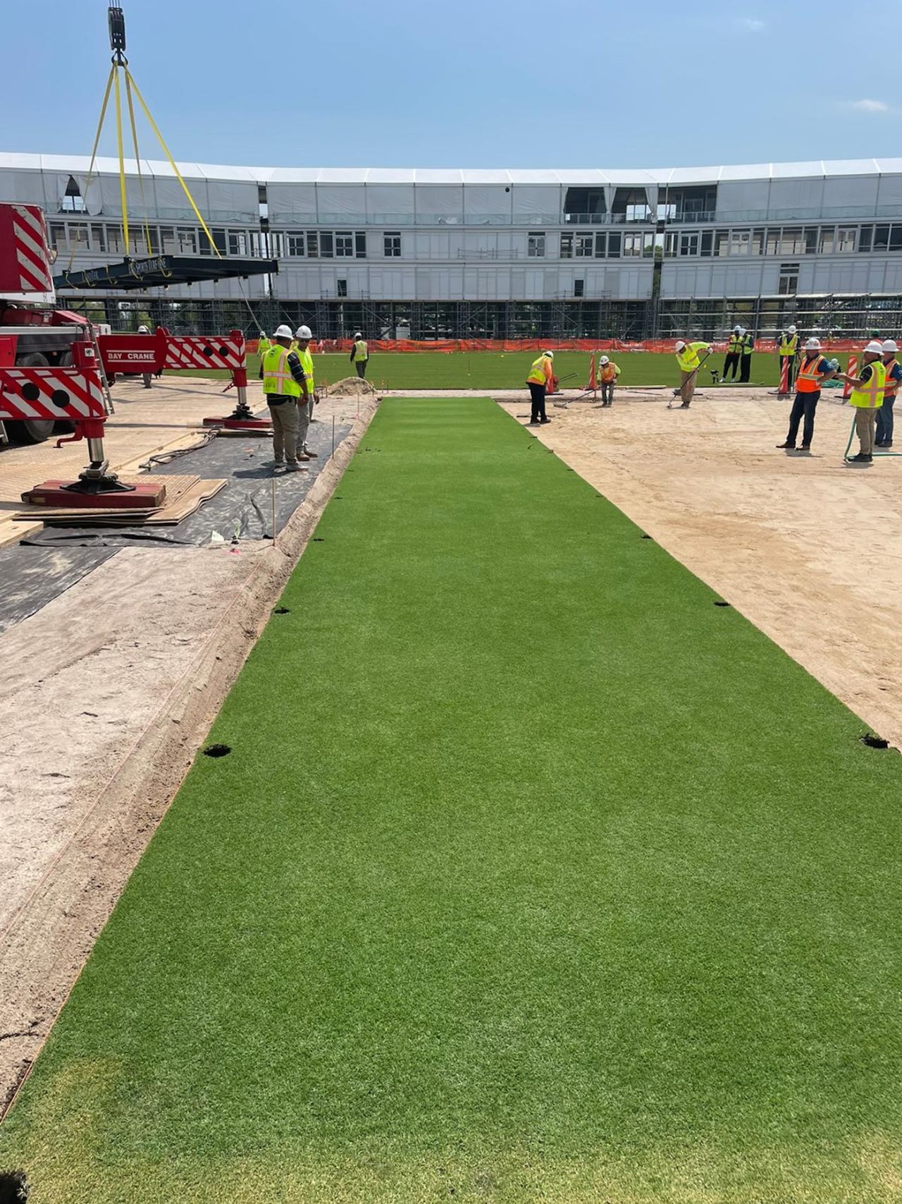 A drop-in pitch is laid at the cricket stadium in Eisenhower Park, Long Island, New York, May 21, 2024