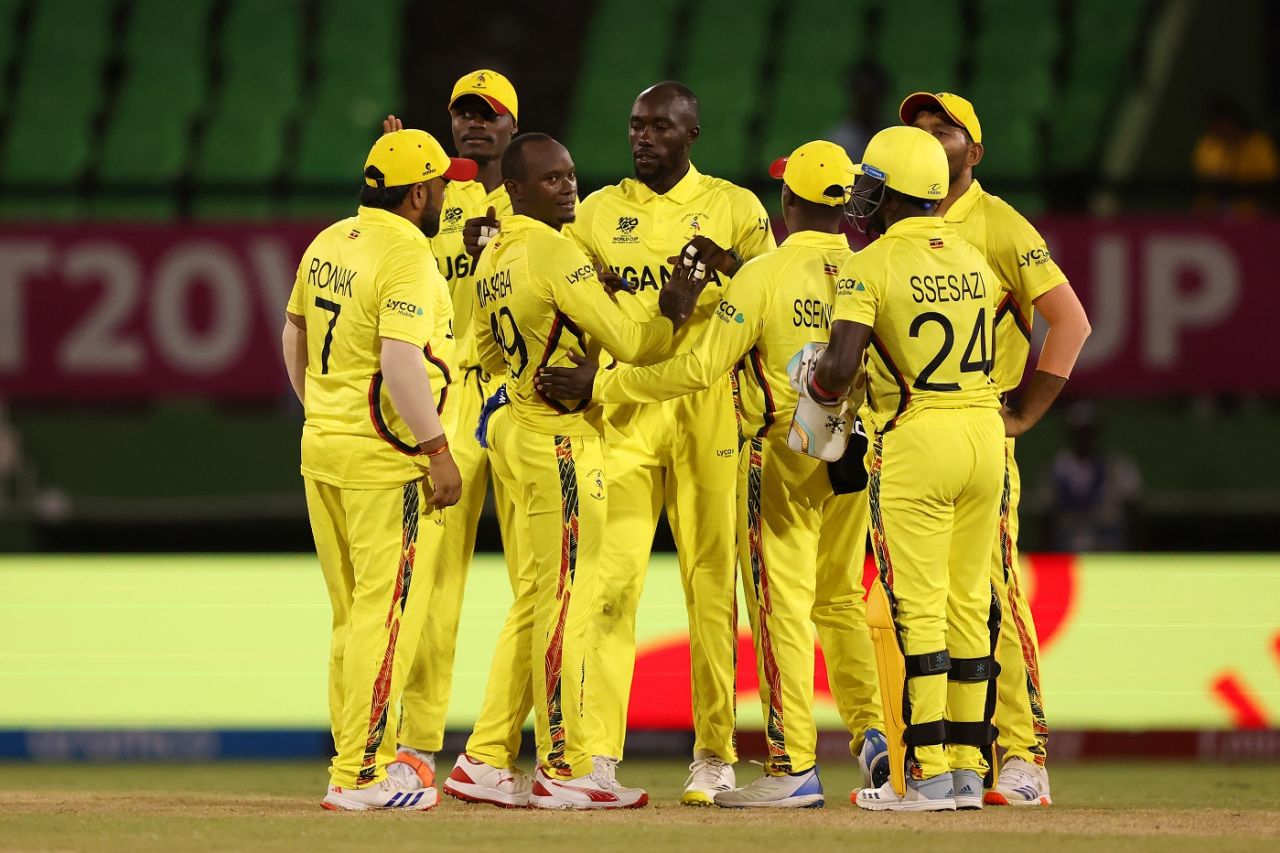 cosmas-kyewuta-celebrates-a-wicket-with-his-team-mates-espncricinfo