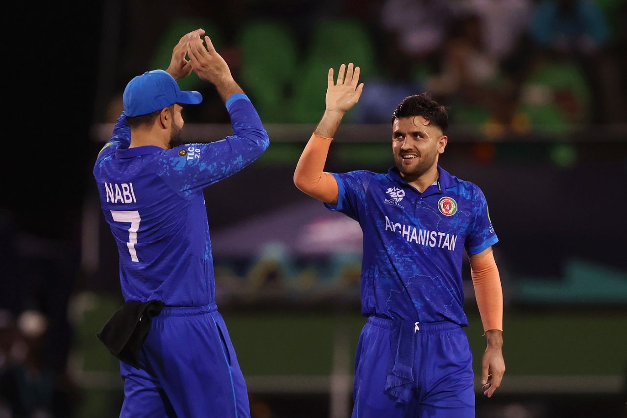 Mohammad Nabi and Fazalhaq Farooqi celebrate Riazat Ali Shah's wicket, Afghanistan vs Uganda, T20 World Cup 2024, Providence, June 3, 2024