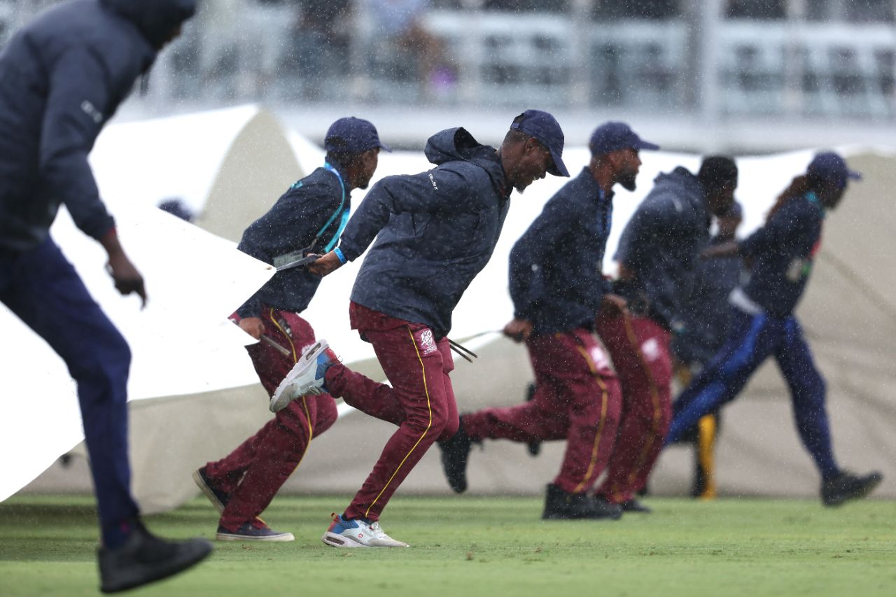 The groundstaff rush on as the rain falls at Bridgetown, England vs Scotland, T20 World Cup, Barbados, June 4, 2024