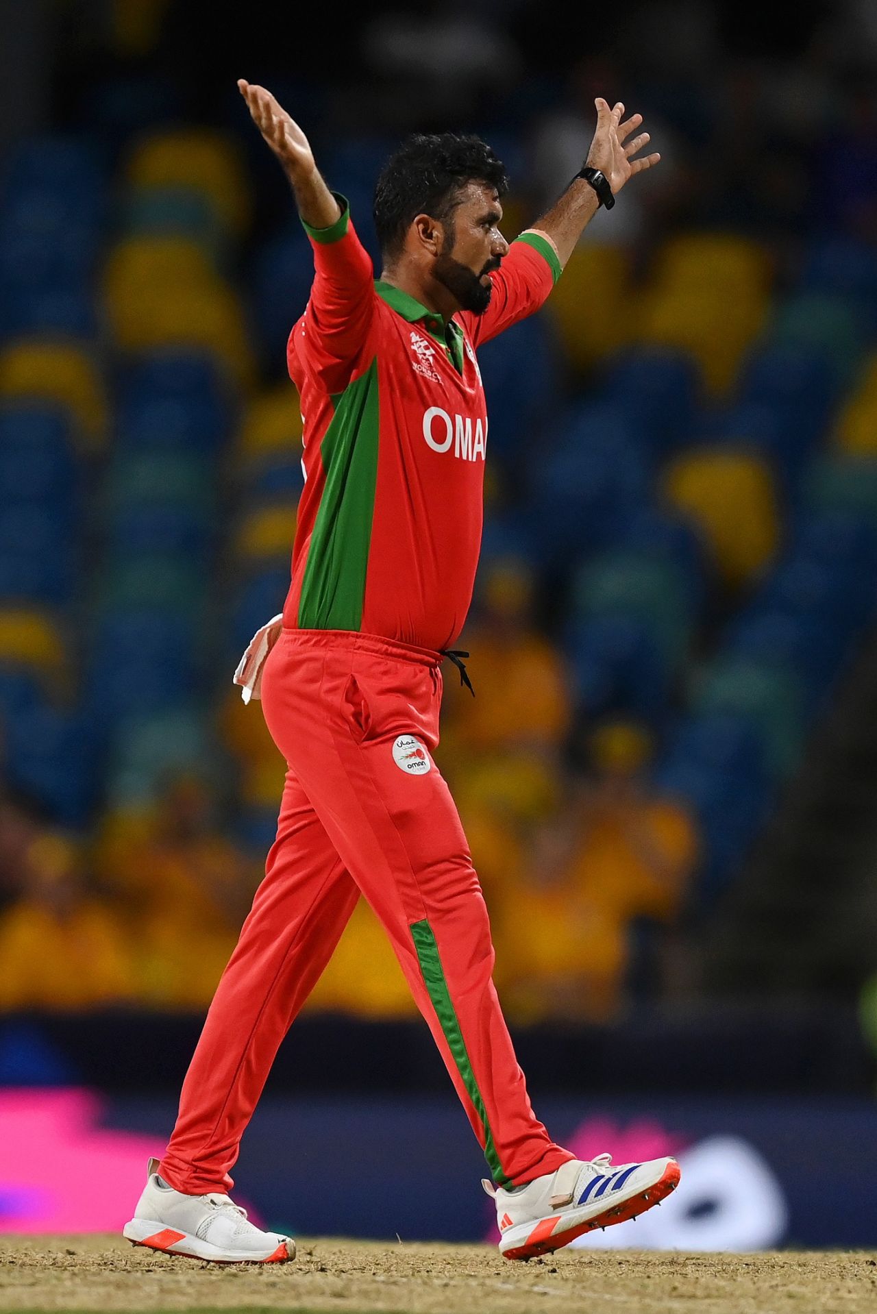 Bilal Khan celebrates the wicket of Travis Head, Australia vs Oman, T20 World Cup, Bridgetown, June 5, 2024