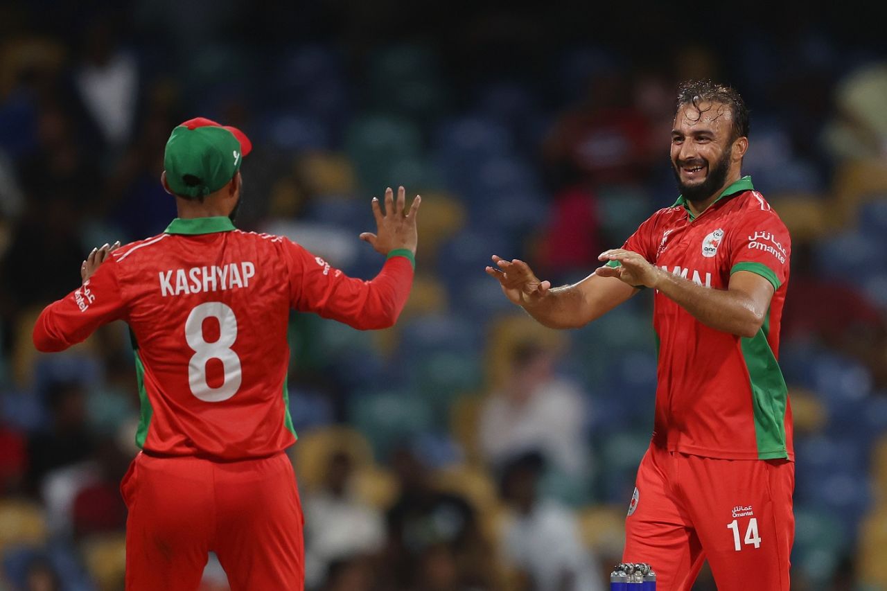 Mehran Khan and Kashyap Prajapati celebrate a wicket, June 5, 2024