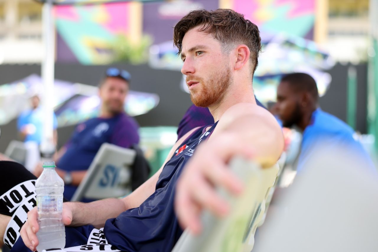 Michael Jones has a drink of water at Scotland's net session ahead of the match against Oman in Antigua, June 8, 2024