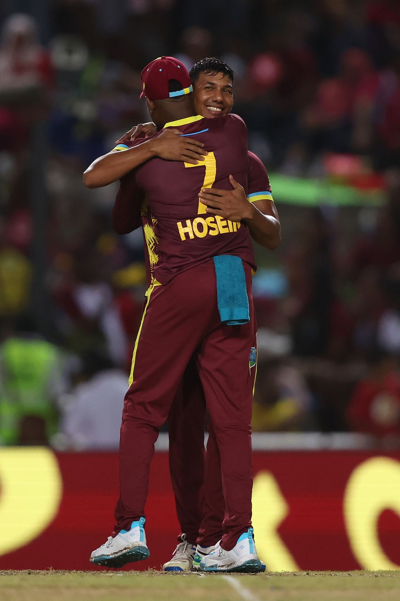 Gudakesh Motie gets a hug from Akeal Hosein after bowling Daryl Mitchell, West Indies vs New Zealand, Men's T20 World Cup 2024, Tarouba, June 12, 2024