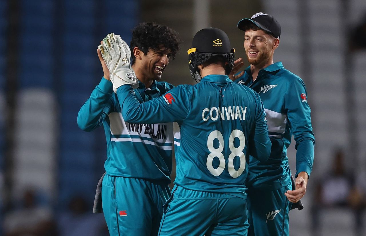 Rachin Ravindra celebrates a wicket with Mitchell Santner and Devon Conway, New Zealand vs Uganda, Men's T20 World Cup, Tarouba, June 14, 2024