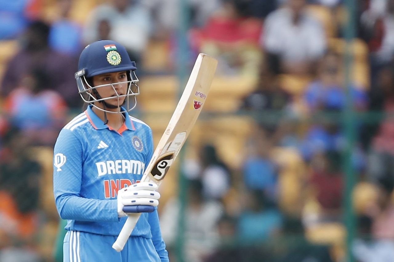 Smriti Mandhana raises her bat after getting to a half-century, India vs South Africa, 1st women's ODI, Bengaluru, June 16, 2024