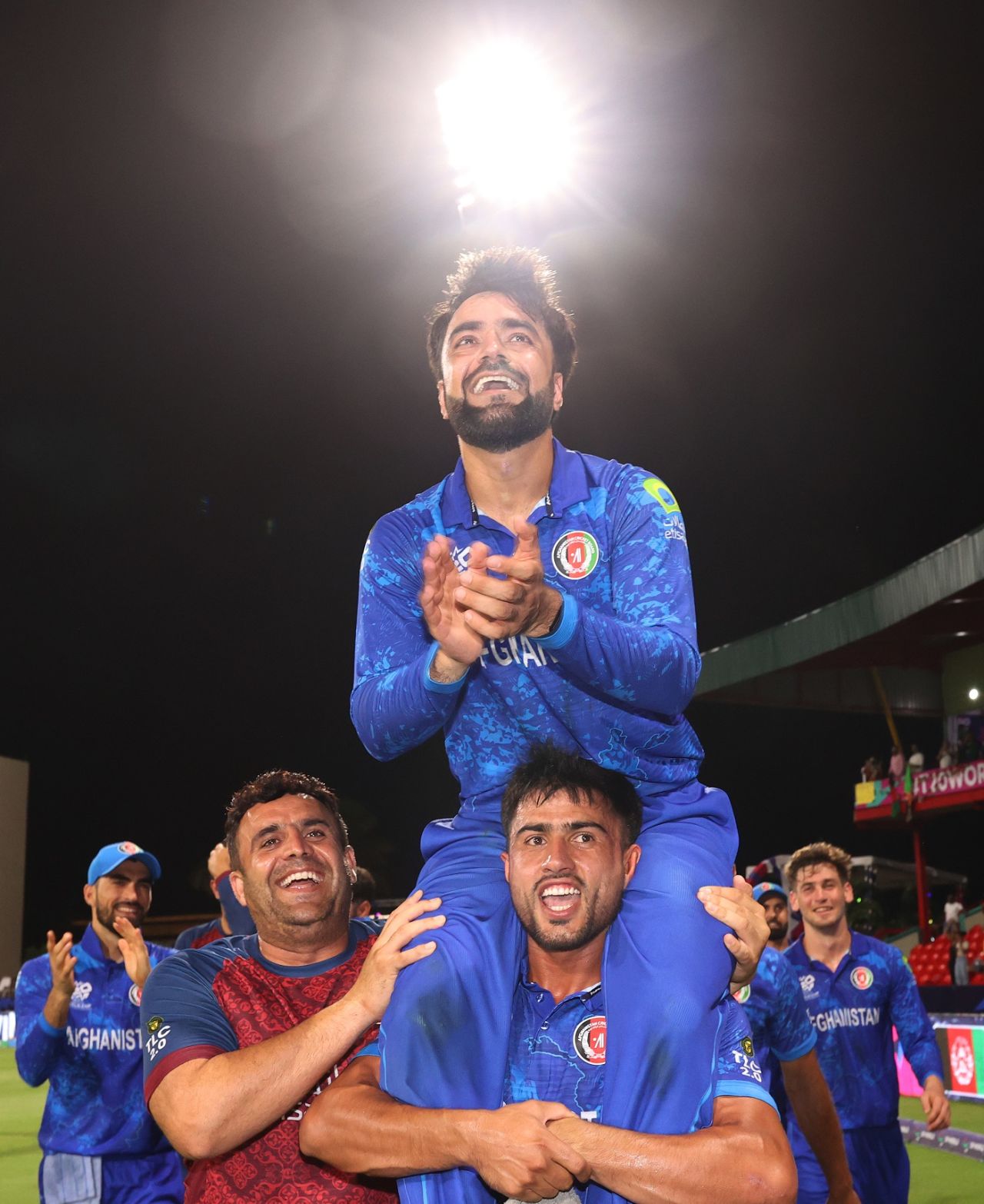 Rashid Khan is carried aloft after the victory by Nangyal Kharote, Afghanistan vs Bangladesh, Super Eight, Group 1, Men's T20 World Cup 2024, Kingstown, June 25, 2024