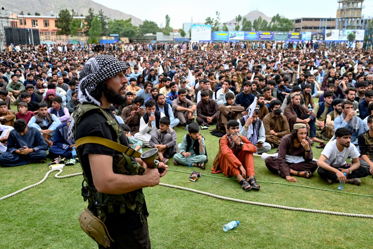 An armed security guard oversees the screening of Afghanistan's World Cup semi-final against South Africa at Kabul International Cricket Stadium, Kabul, June 27, 2024