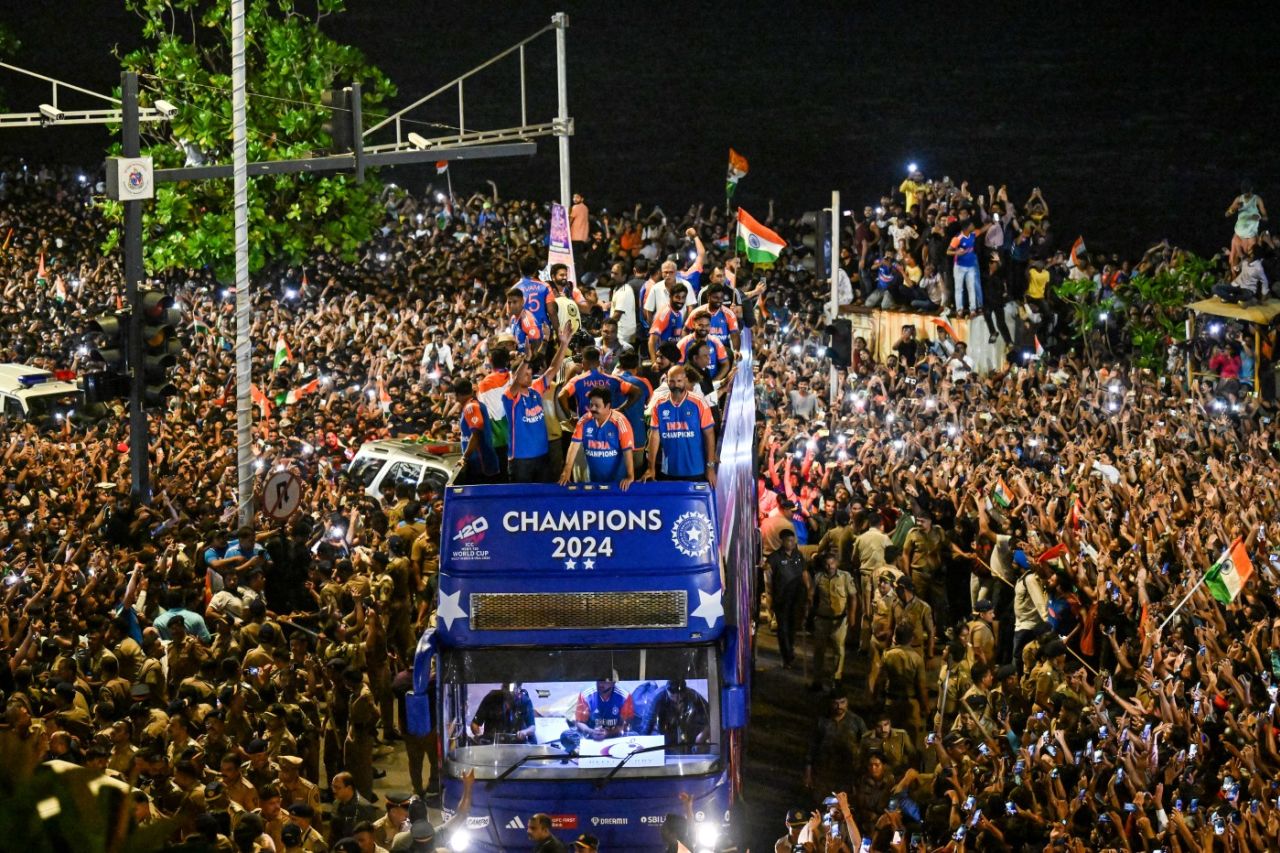 The Indian players and BCCI bigwigs wind their way through the Marine Drive crowds, Mumbai, July 4, 2024