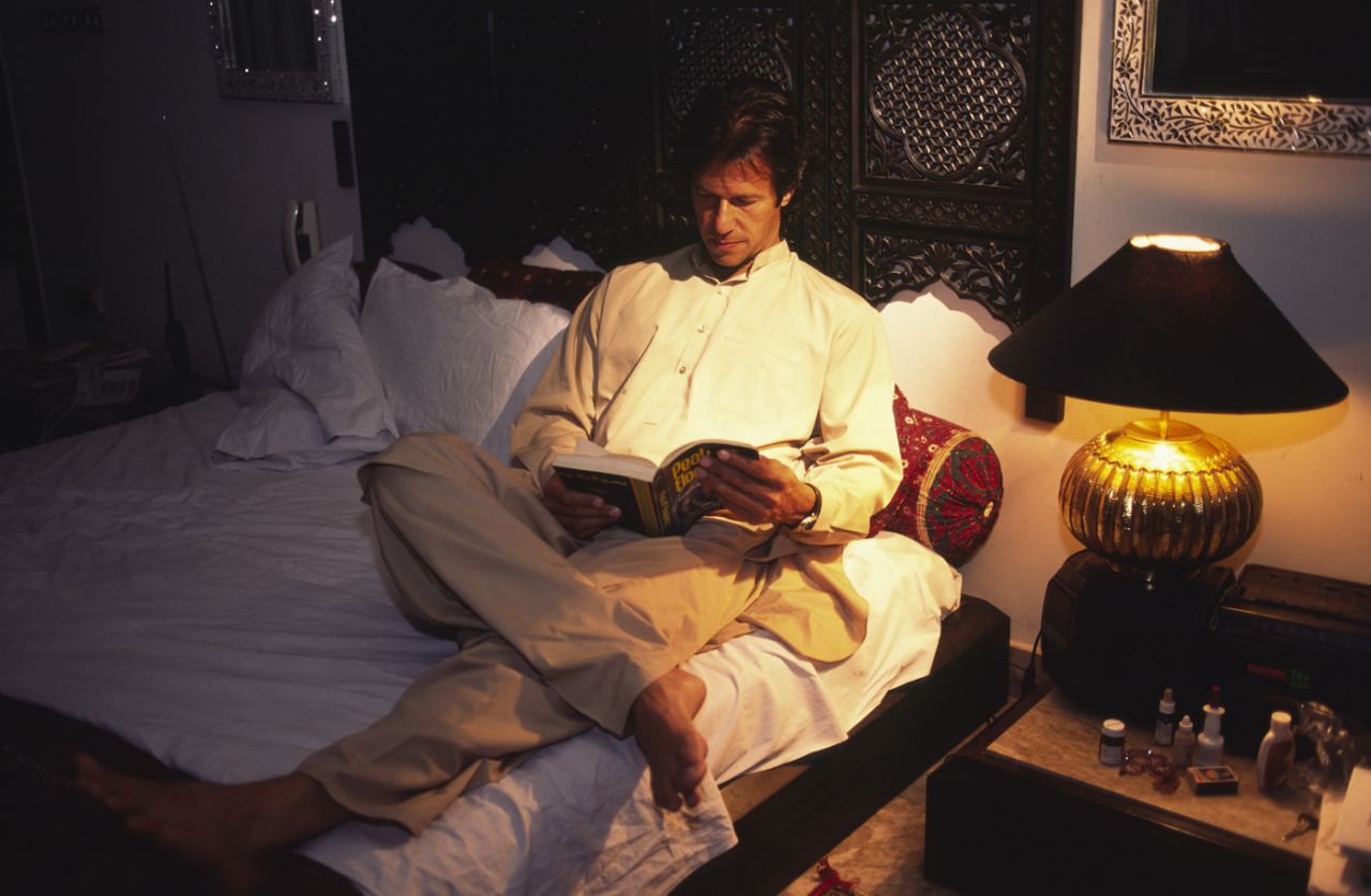 Imran Khan reads in his bedroom, Lahore, July 17, 1999