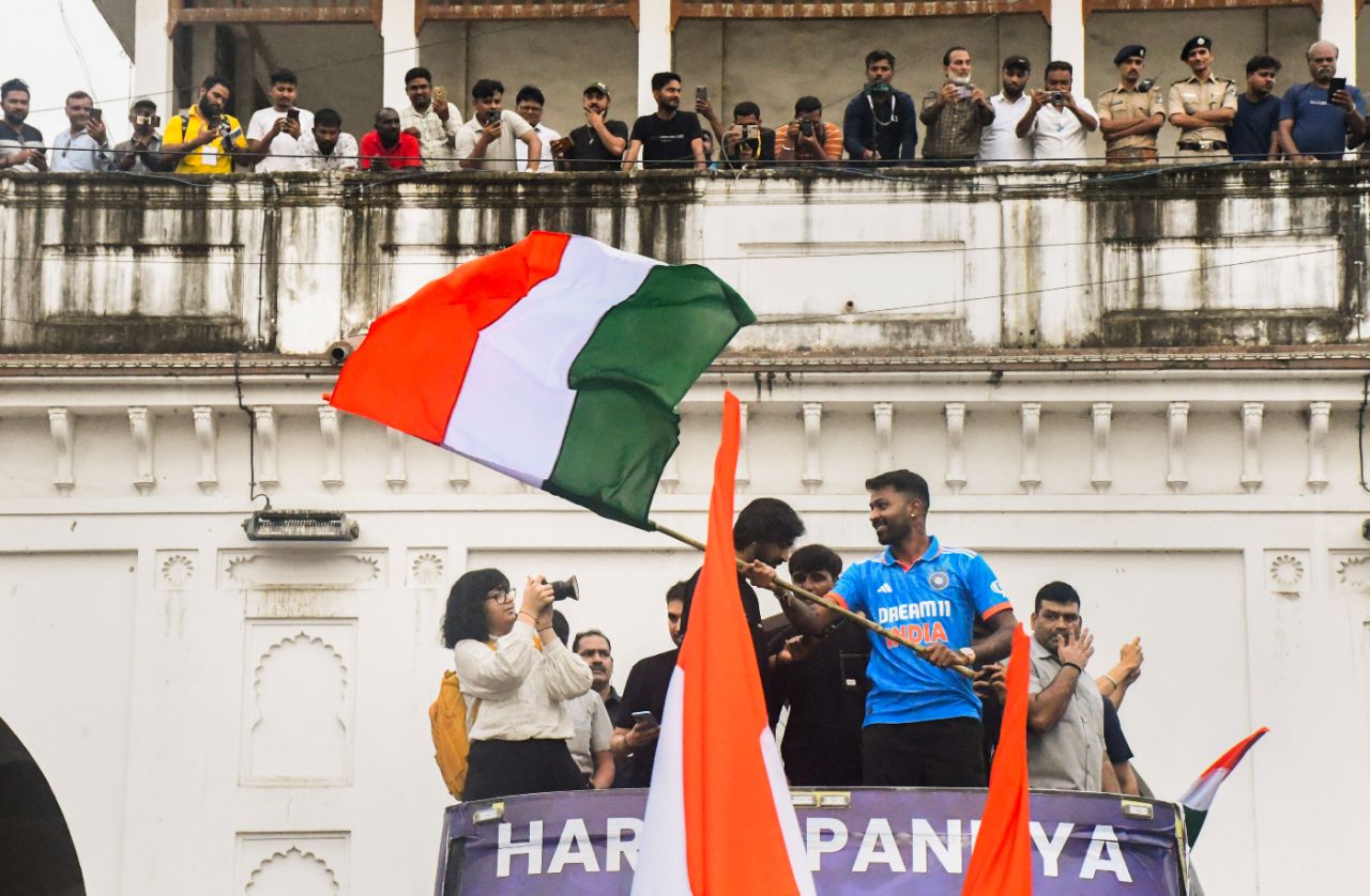 Hardik Pandya waves to fans from an open-top bus during a felicitation in Vadodara, following India's T20 World Cup win, Vadodara, July 15, 2024