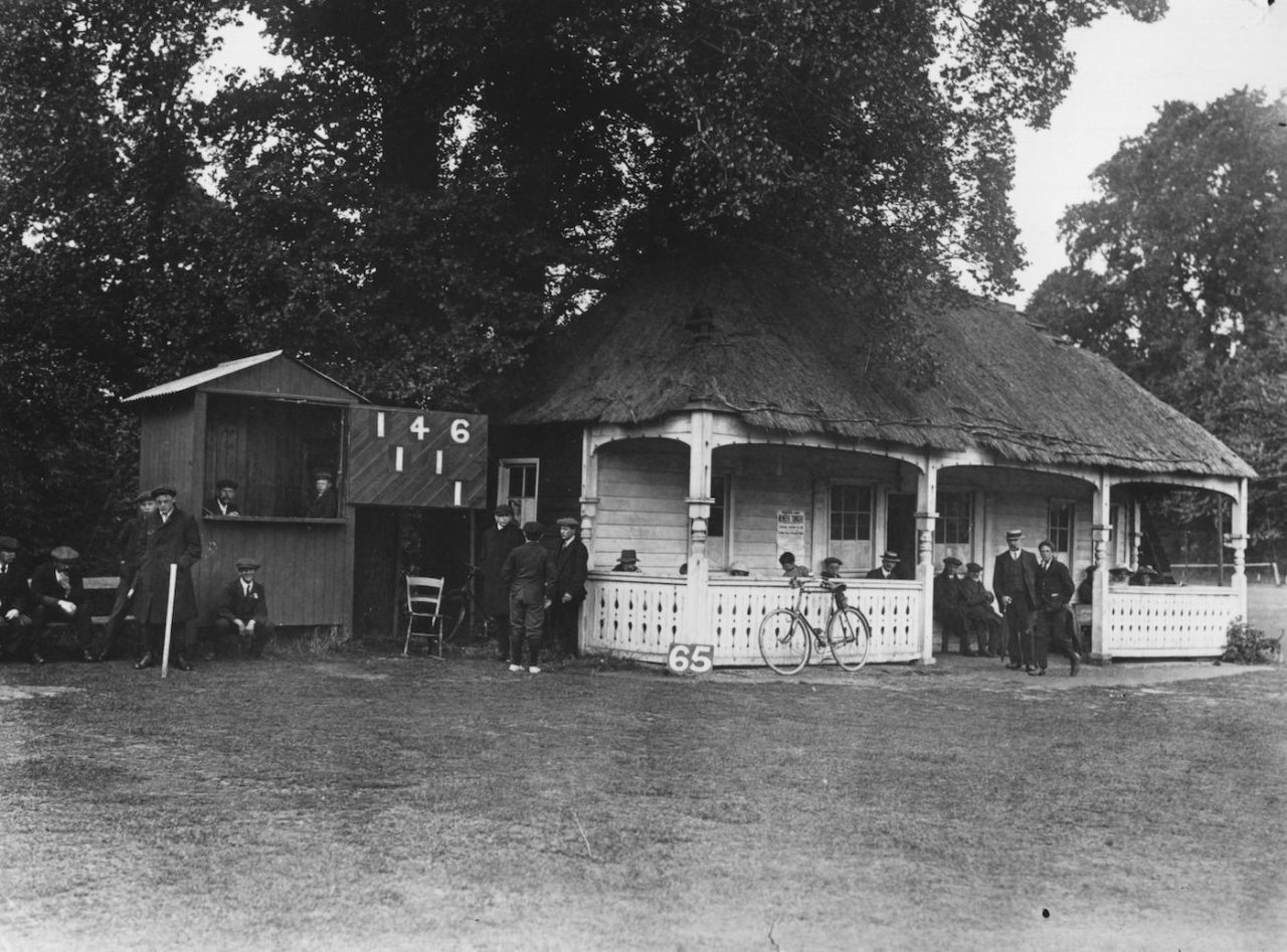 Teams gather outside a cricket pavilion that was originally Sutton railway station, August 23, 1912