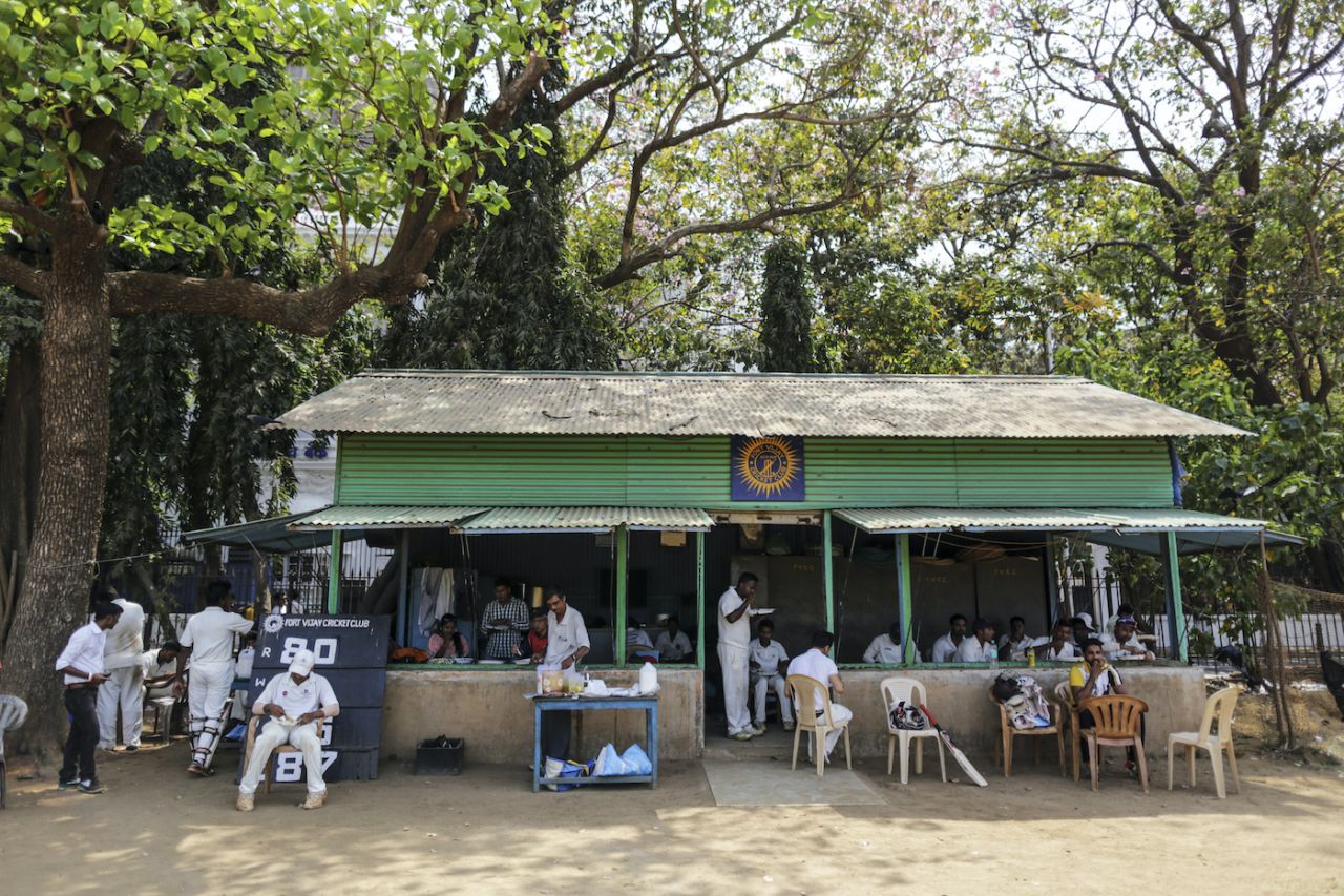 Players eat outside the Fort Vijay Cricket Club pavilion at Azad Maidan during a lunch break , Mumbai, March 6, 2016