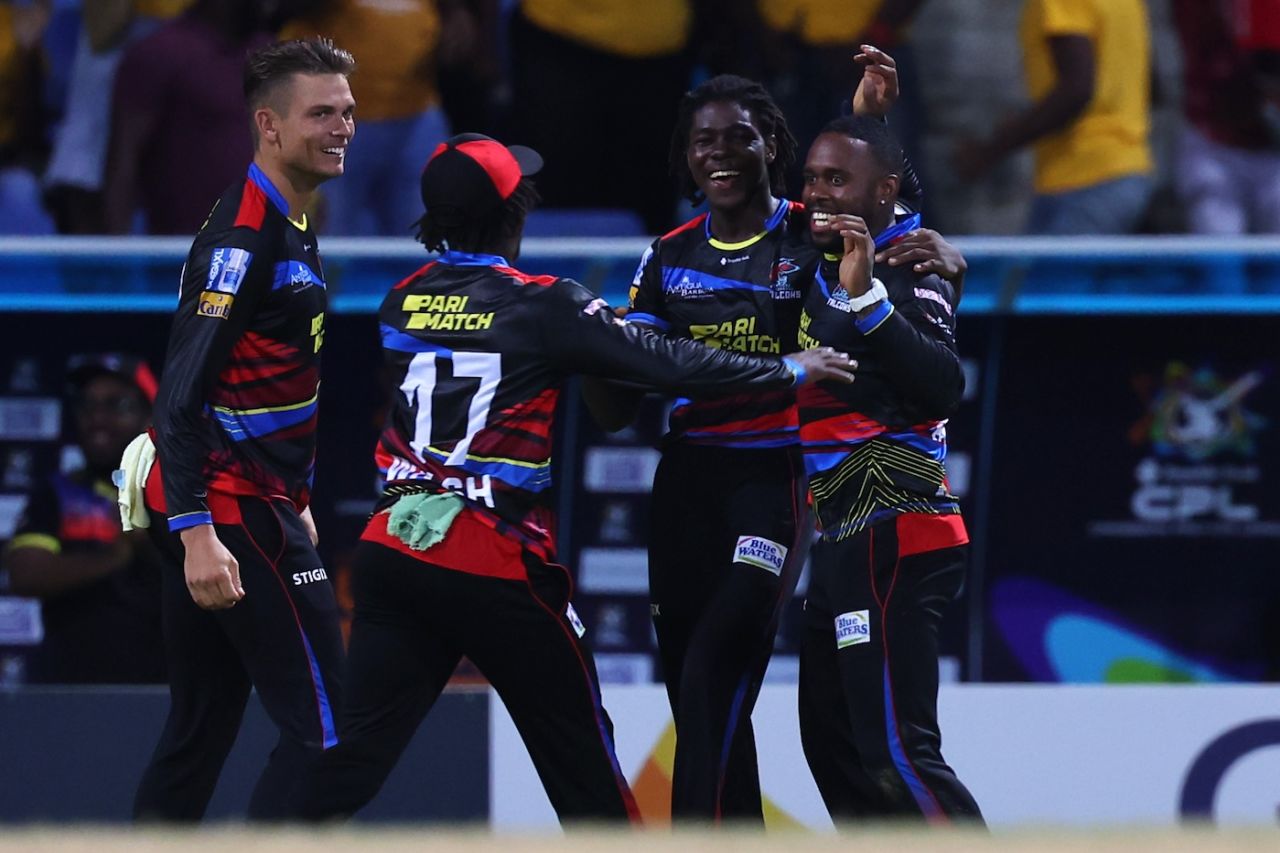 Team-mates get around Fabian Allen after one of his wickets, Antigua And Barbuda Falcons vs Trinbago Knight Riders, CPL 2024, North Sound, September 5, 2024