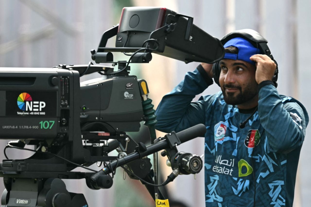 With no play on, Hashmatullah Shahidi amuses himself by getting behind a cameraAfghanistan vs New Zealand, Only Test, Greater Noida, 1st day, September 9, 2024