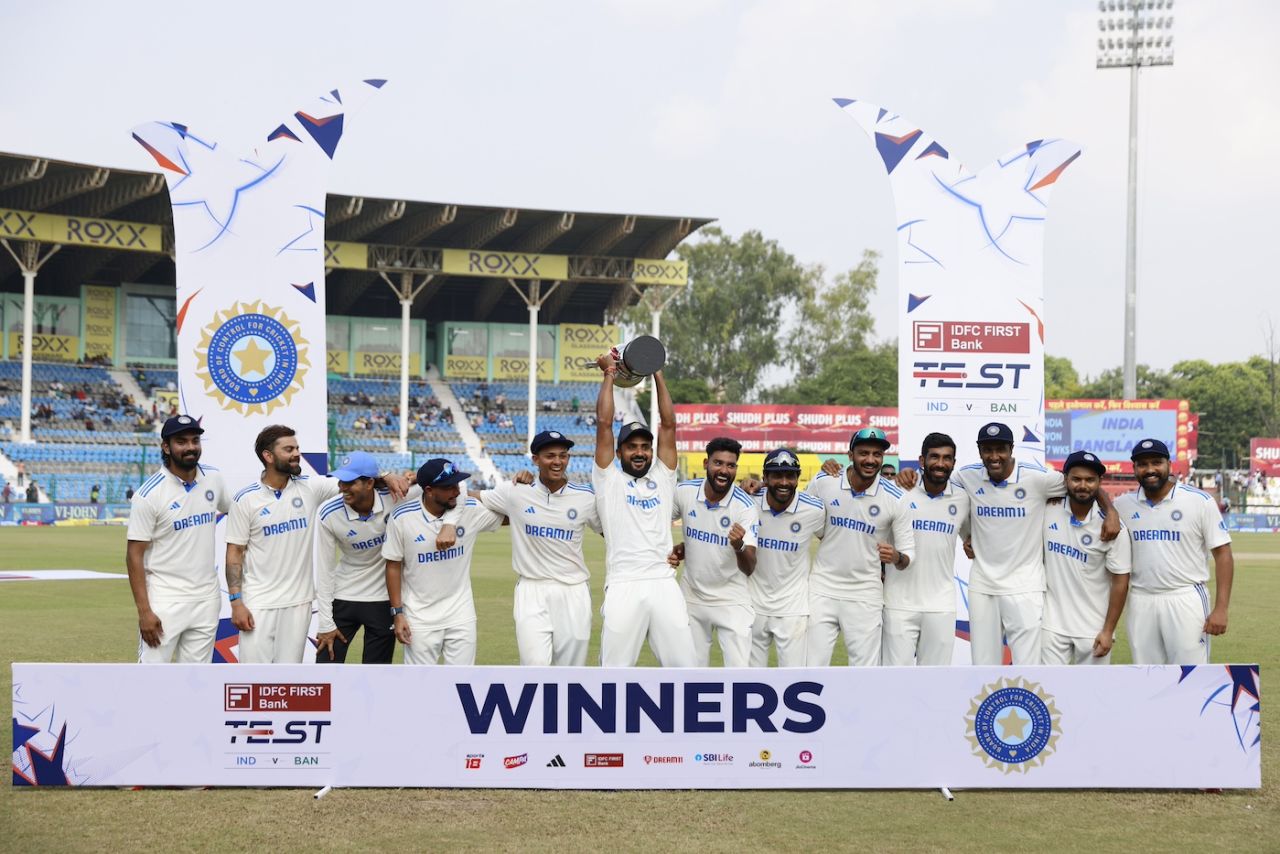 Akash Deep holds the series trophy aloft as the Indians celebrate, India vs Bangladesh, 2nd Test, Kanpur, 5th day, October 1, 2024