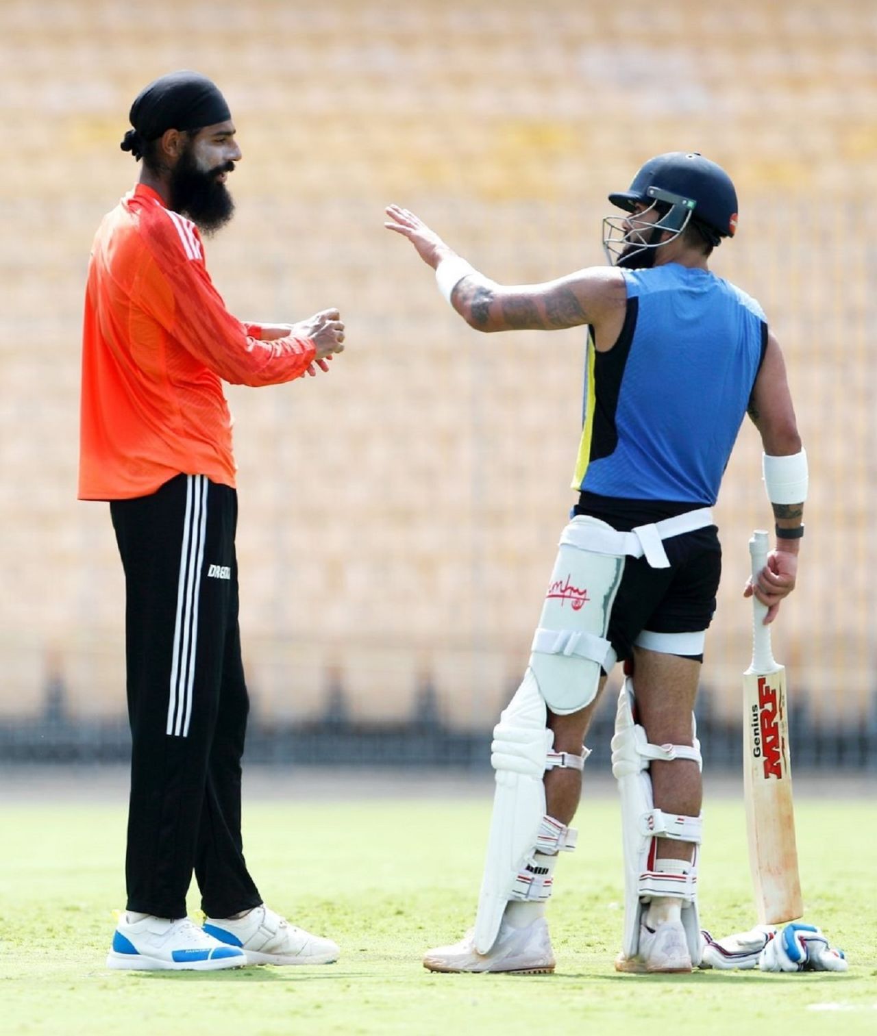 Gurjapneet Singh has a chat with Virat Kohli during his stint as an India net bowler, Chennai, September 18, 2024