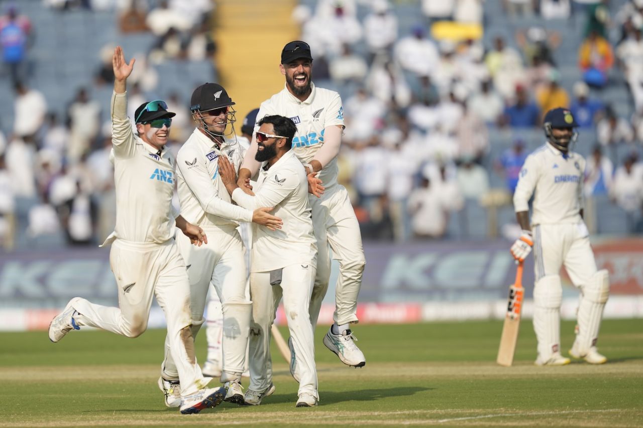 Ajaz Patel is mobbed by his team-mates after sealing a historic win, India vs New Zealand, 2nd Test, Pune, 3rd day, October 26, 2024