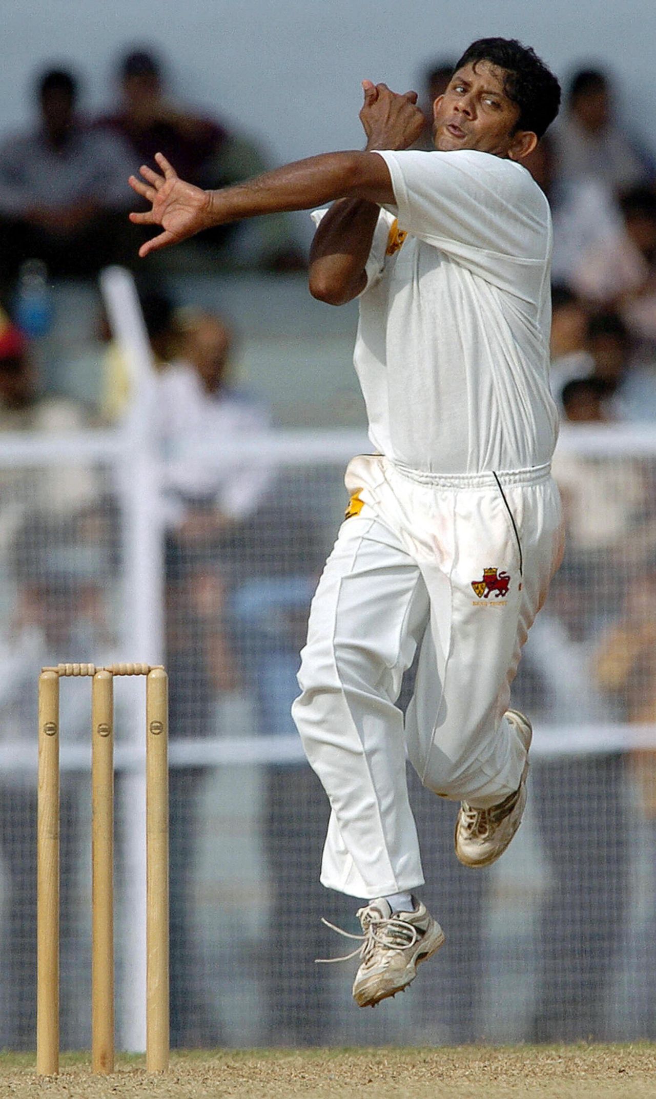 Sairaj Bahutule bowling against the Australians, September 30, 2004