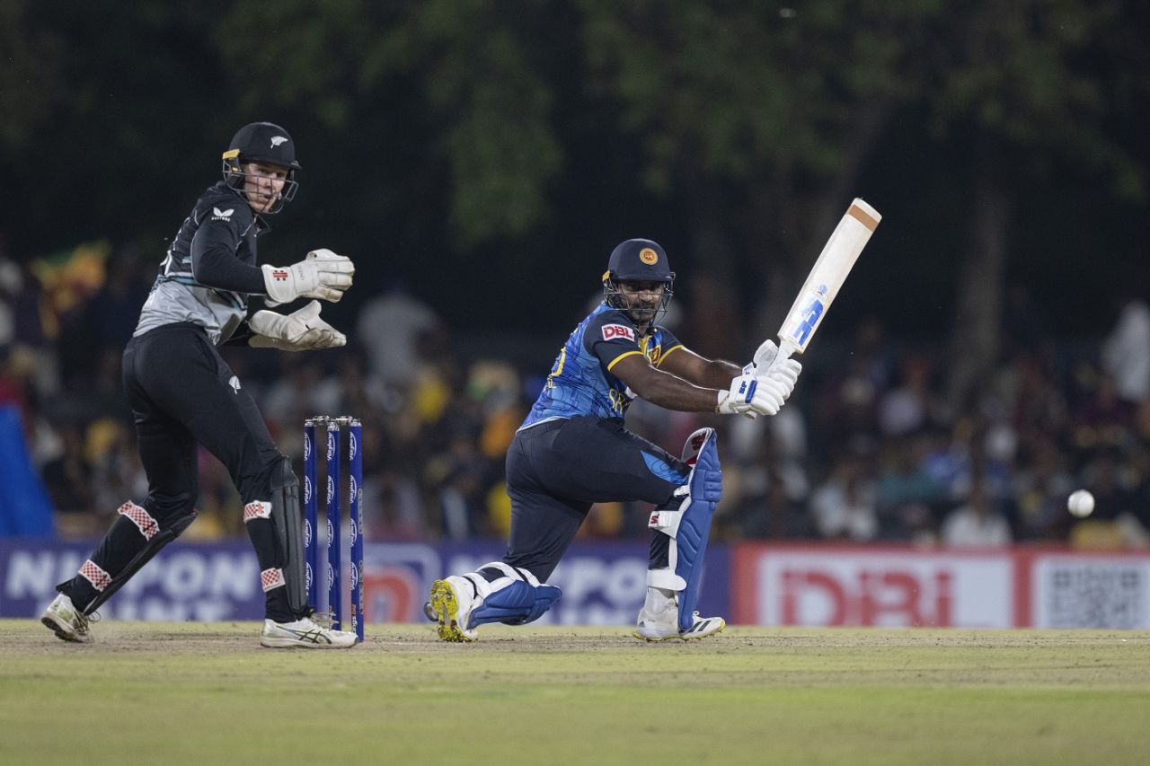 Mitchell Hay looks on as Kusal Perera plays a sweep