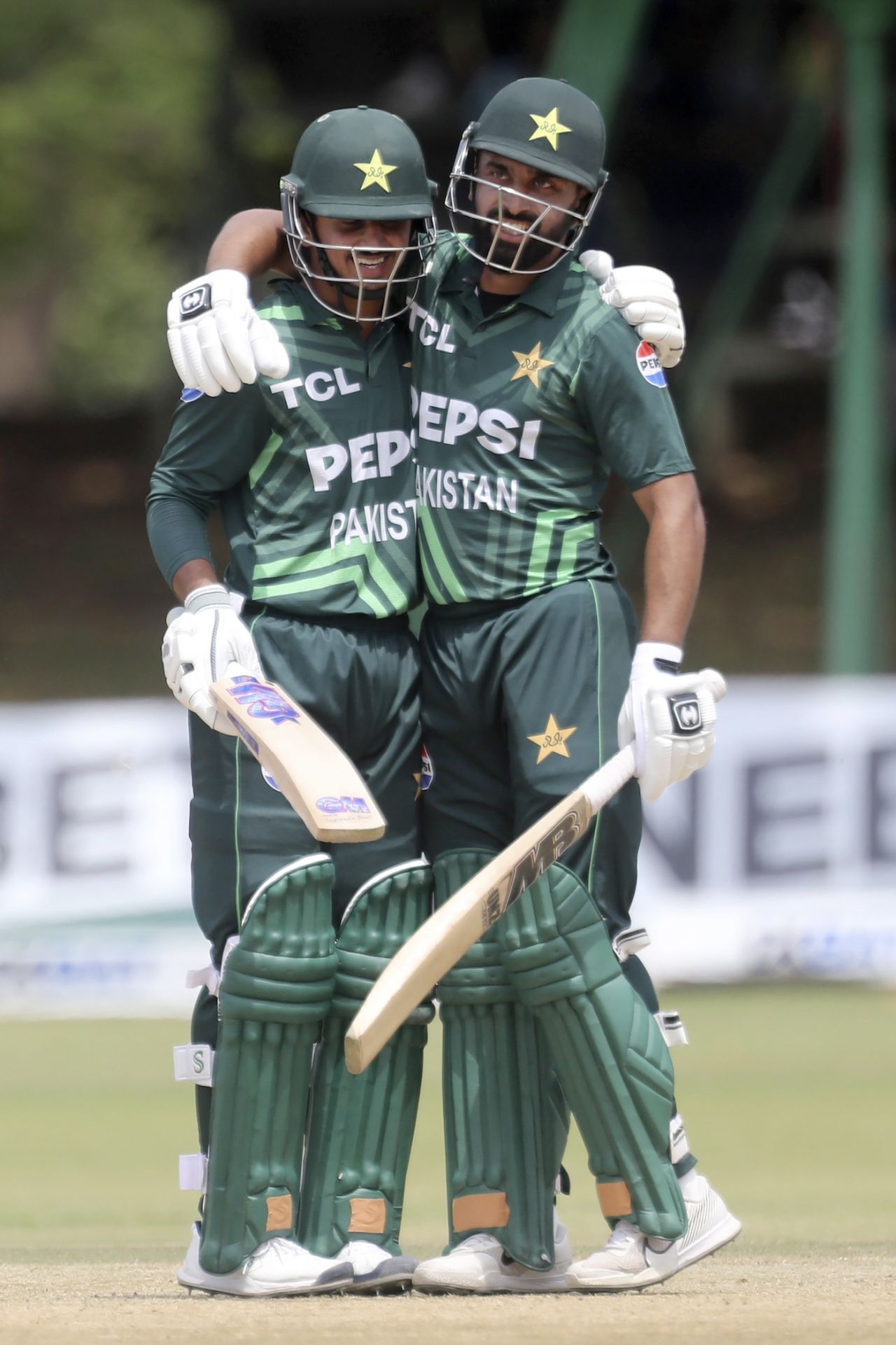Saim Ayub is congratulated by Abdullah Shafique after reaching his century, Zimbabwe vs Pakistan, 2nd ODI, Bulawayo, November 26, 2024