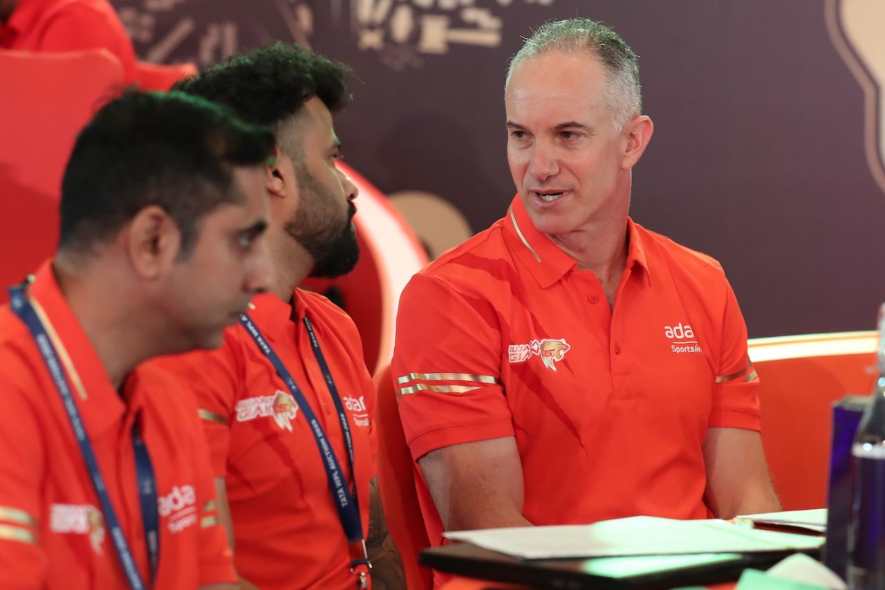 Gujarat Giants head coach Michael Klinger consults his colleagues at the WPL auction table, Bengaluru, December 15, 2024