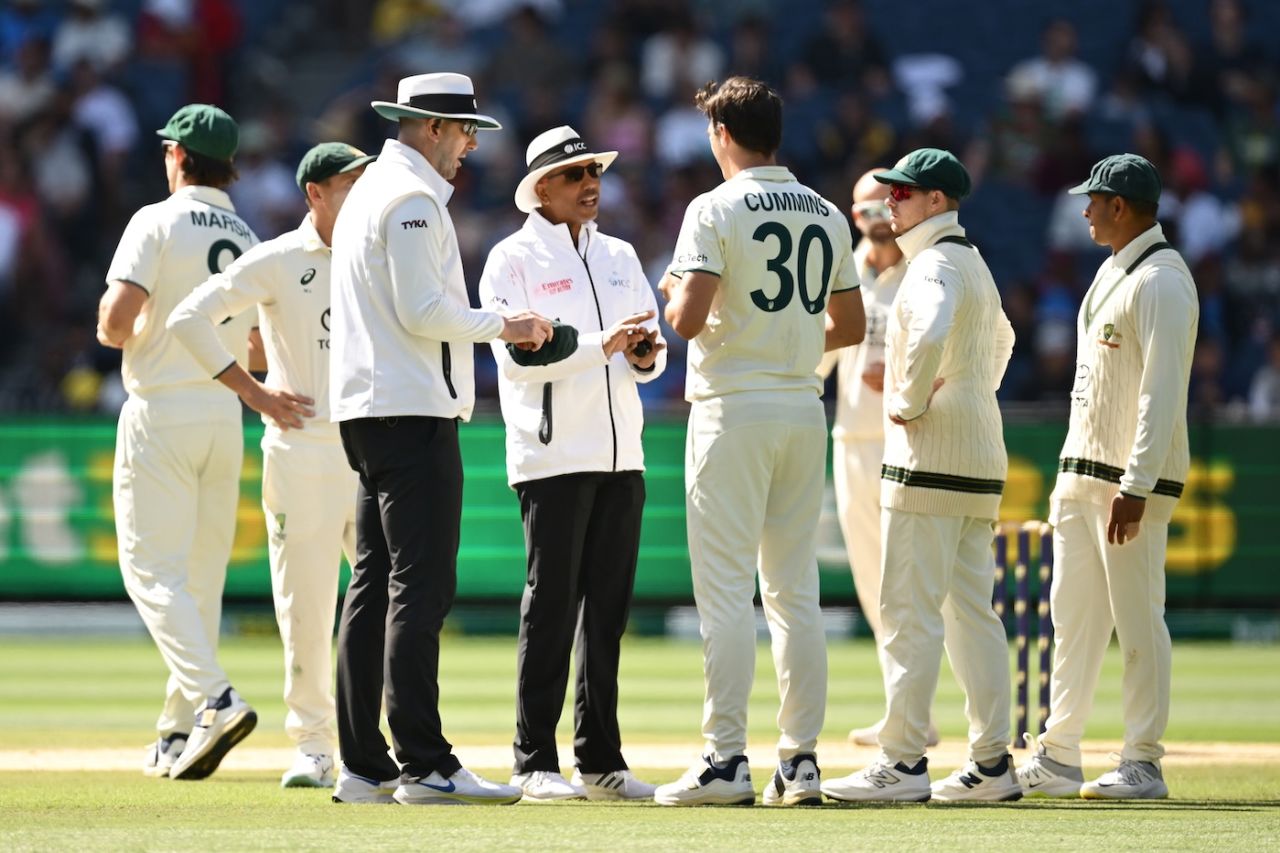 Pat Cummins speaks to umpires Michael Gough and Joel Wilson after a decision went against Australia, Australia vs India, 4th Test, Melbourne, 4th day, December 29, 2024