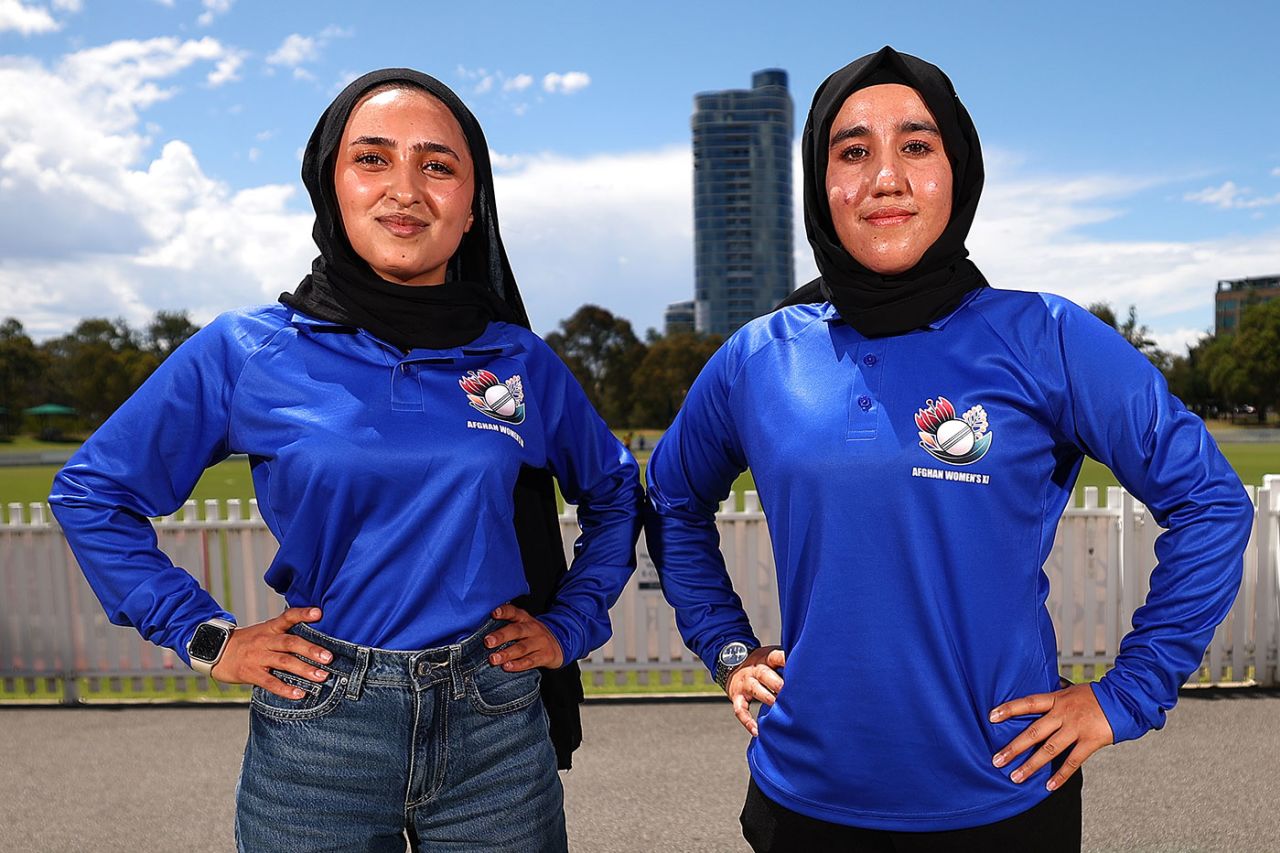 Firooza Amiri and Nahida Sapan pose in their playing shirts ahead of the Afghanistan Women's XI match, Junction Oval, January 27, 2025