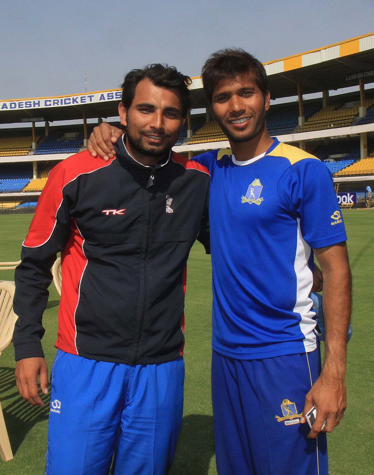 Mohammed Shami and Ashok Dinda pose for photos after East Zone's Duleep Trophy win over Central Zone, 3rd day, February 14, 2012