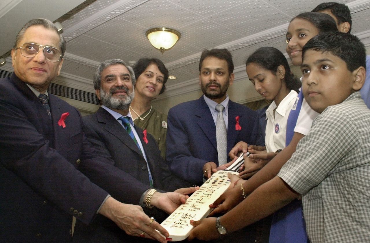 BCCI president Jagmohan Dalmiya (first at left) and ICC president Ehsan Mani (second from left) present a cricket bat signed by the Indian cricket team to a United Nations Programme on HIV-AIDS (UNAID) functionary, Cricket Club of India,Mumbai, September 18 2003