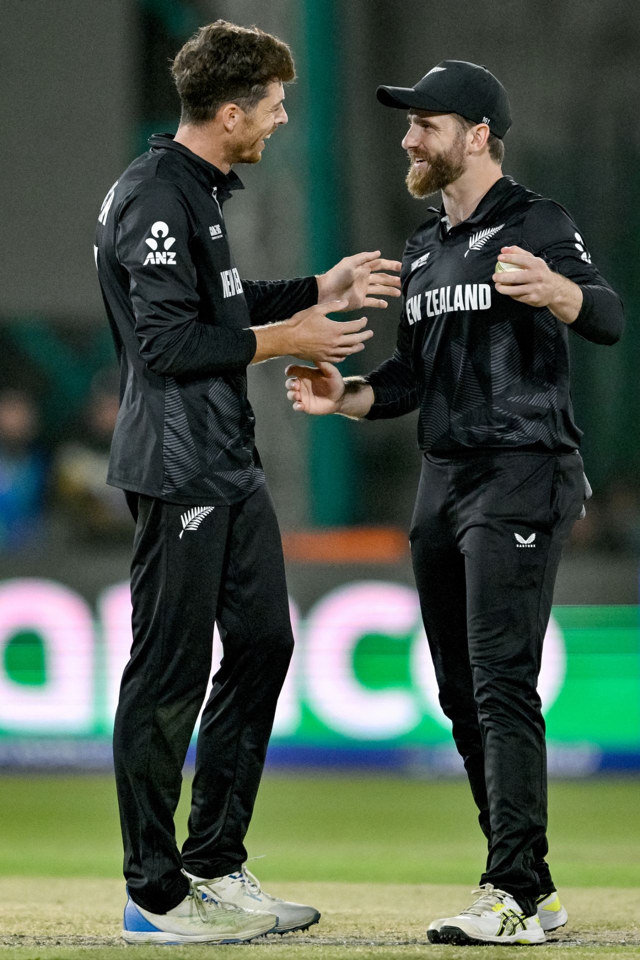 Mitchell Santner and Kane Williamson have a chat after combining to send back Babar Azam, Pakistan vs New Zealand, ICC Men's Champions Trophy, Karachi, February 19, 2025