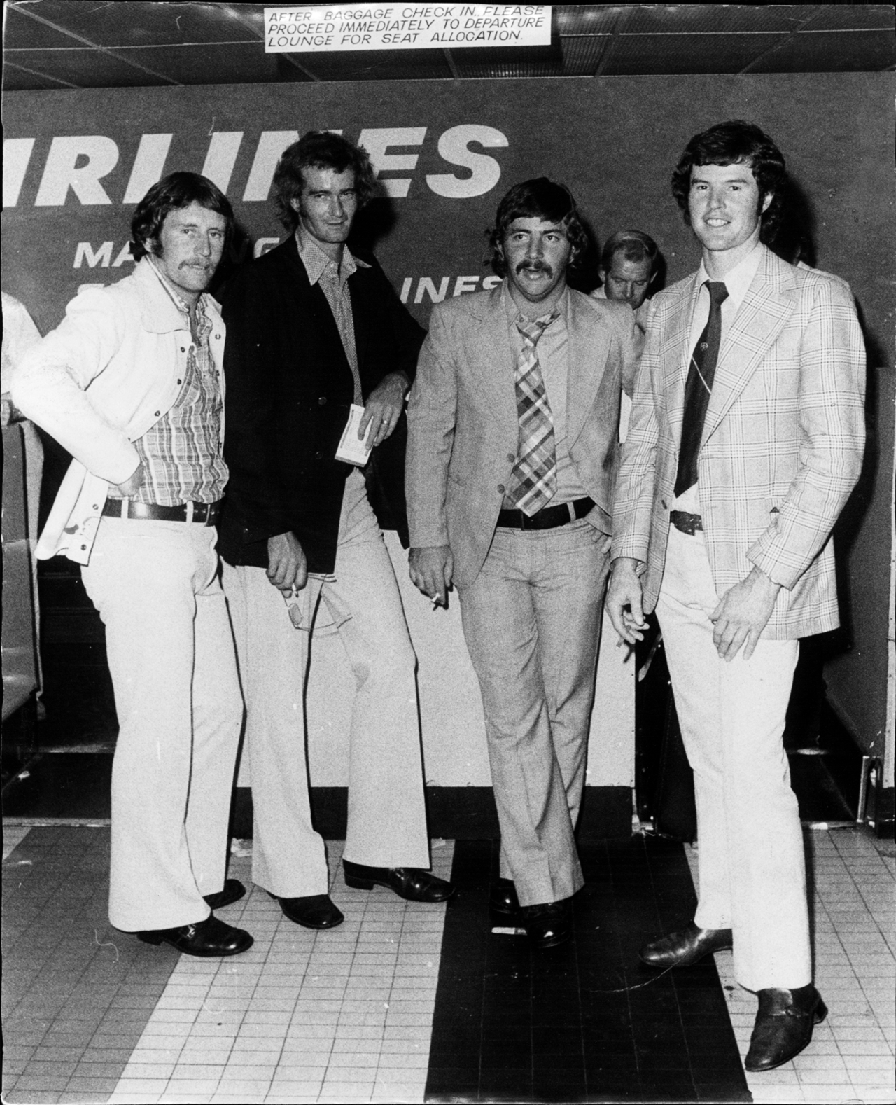 Ian Chappell, Ashley Mallett, Rod Marsh and Ashley Woodcock arrive at Sydney airport, April 1, 1974