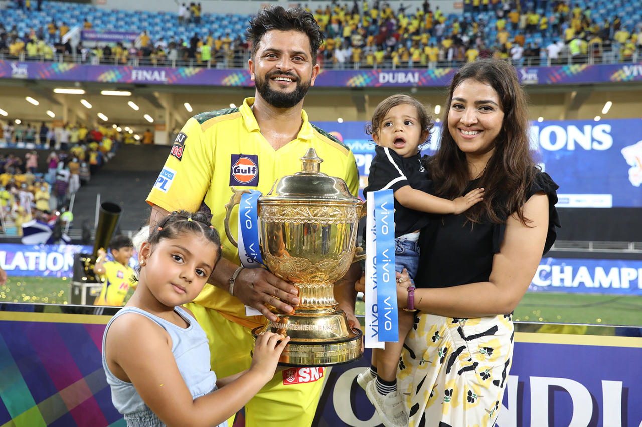 Suresh Raina and his family pose with the IPL trophy, Chennai Super Kings vs Kolkata Knight Riders, IPL 2021 final, Dubai, October 15, 2021