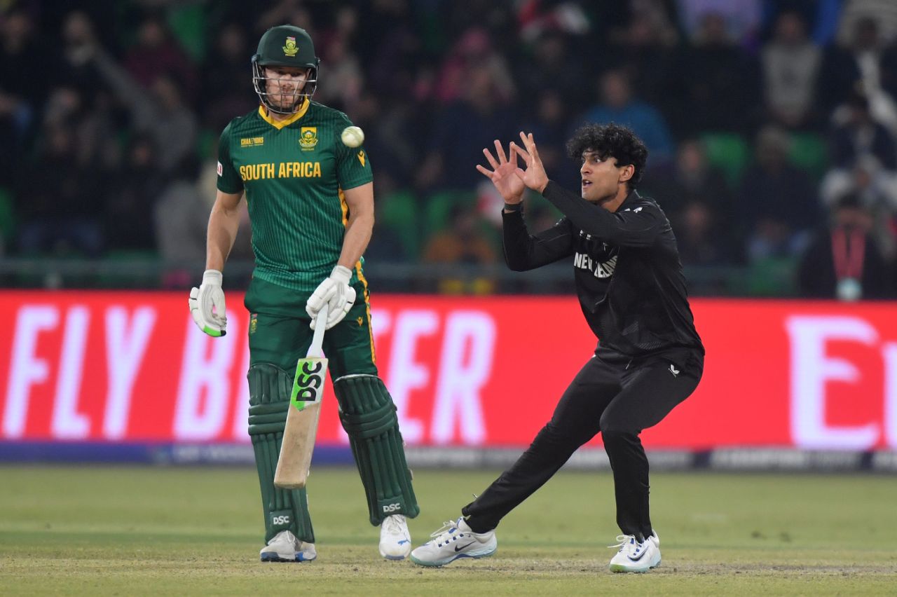 Rachin Ravindra on his way to pouching a return-catch to send back Aiden Markram, New Zealand vs South Africa, Champions Trophy semi-final, Lahore, March 5, 2025