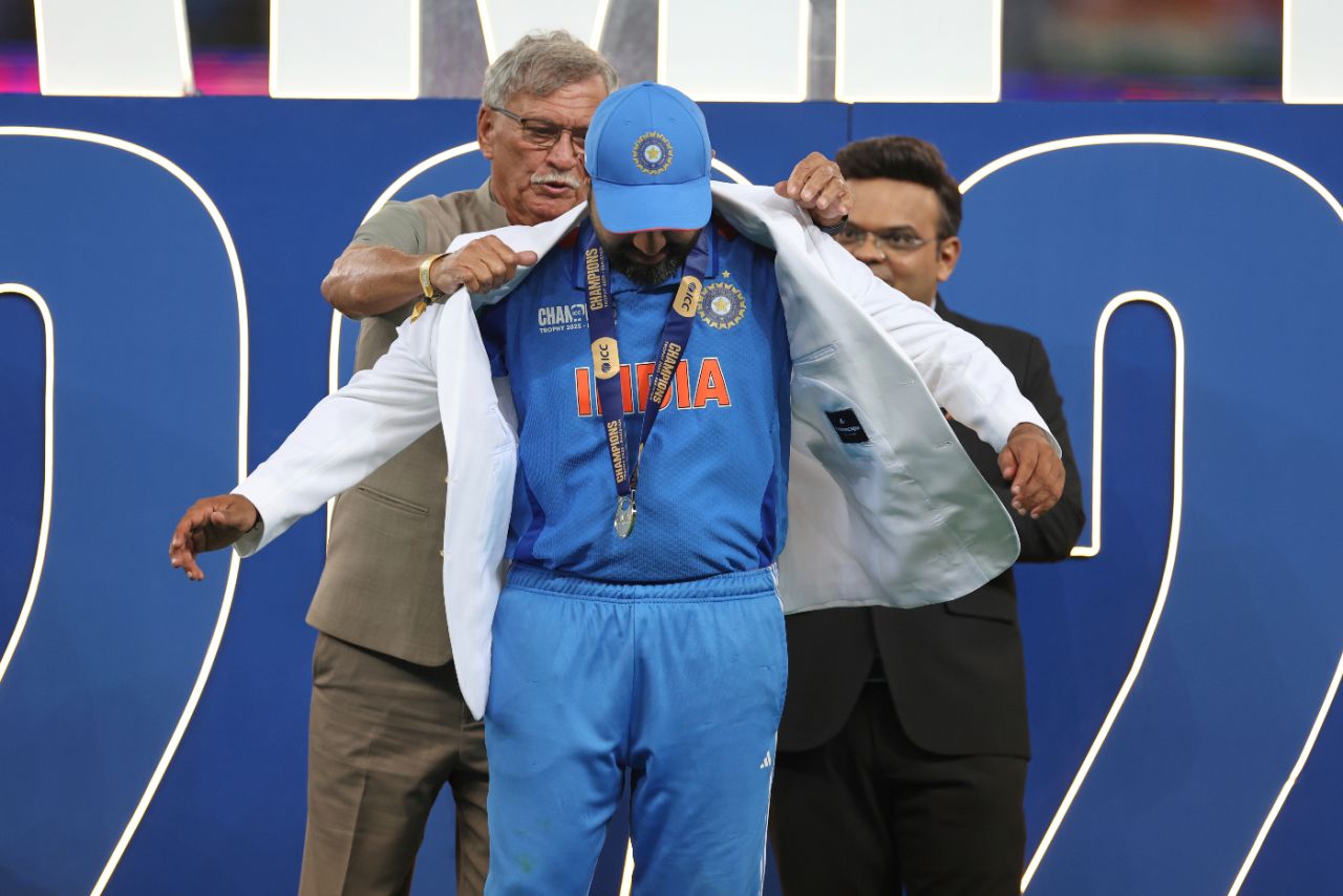 BCCI president Roger Binny hands India captain Rohit Sharma his winner's jacket as ICC chair Jay Shah looks on, India vs New Zealand, Champions Trophy final, Dubai, March 9, 2025