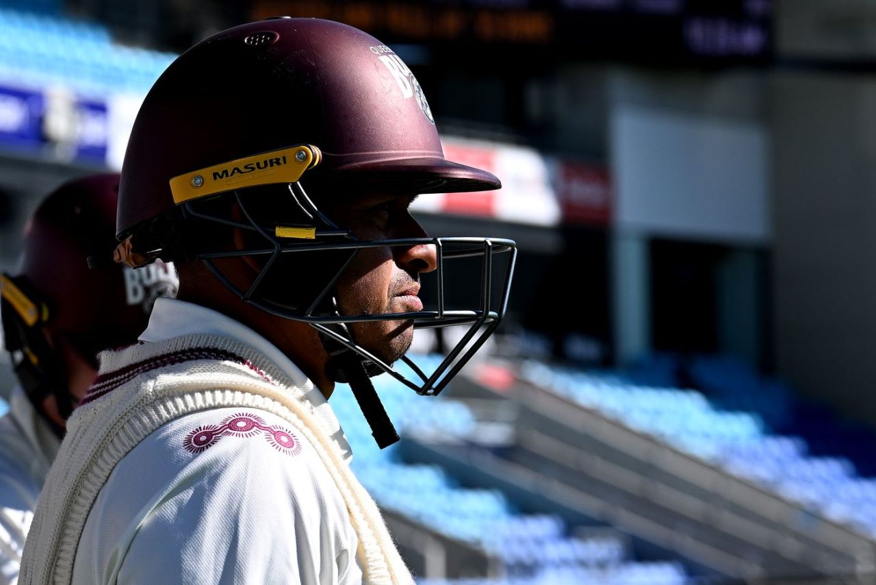 Usman Khawaja waits to walk out to bat for Queensland